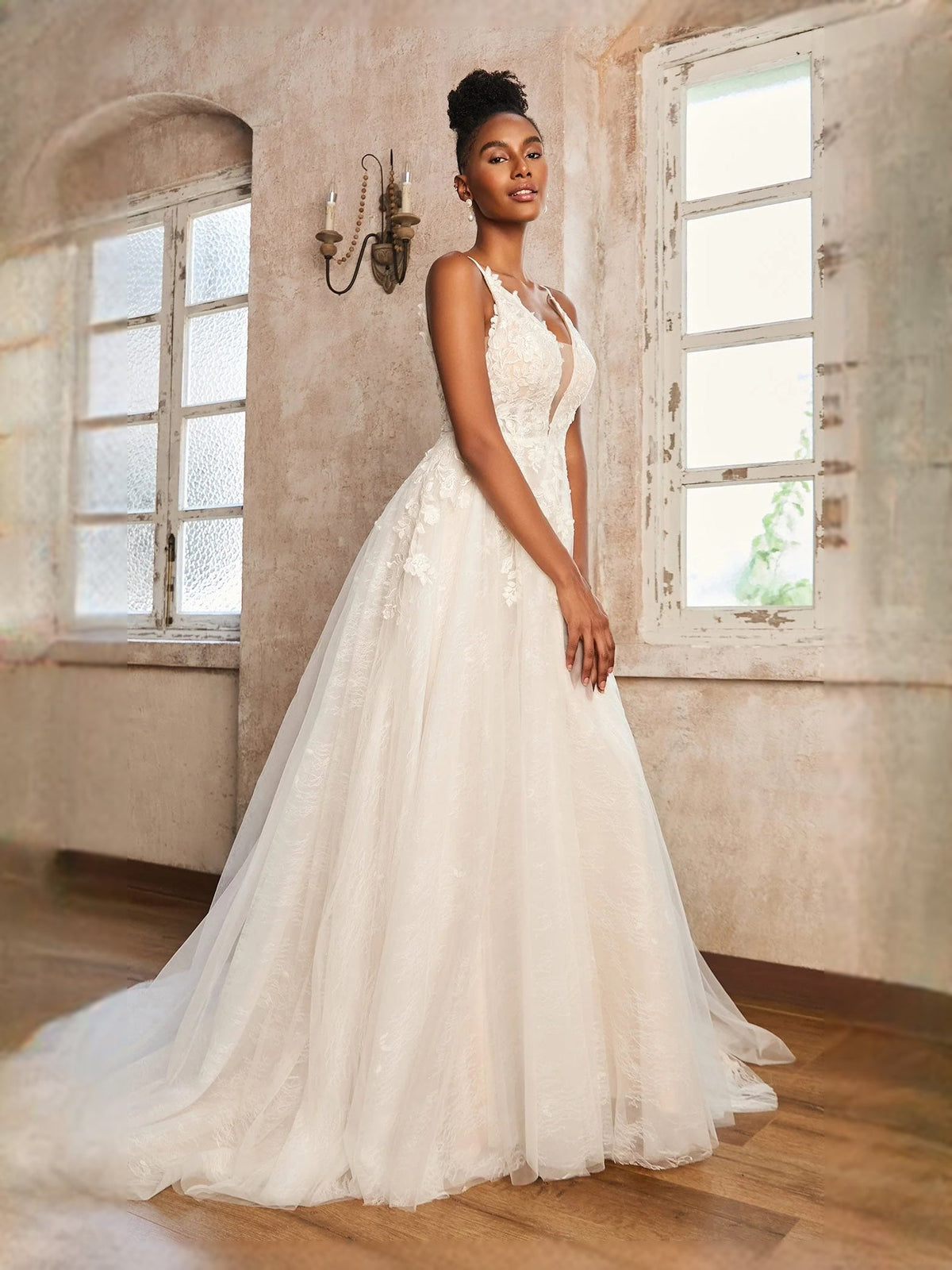 Ivory sleeveless V-neck A-line wedding dress with lace appliques and full tulle skirt