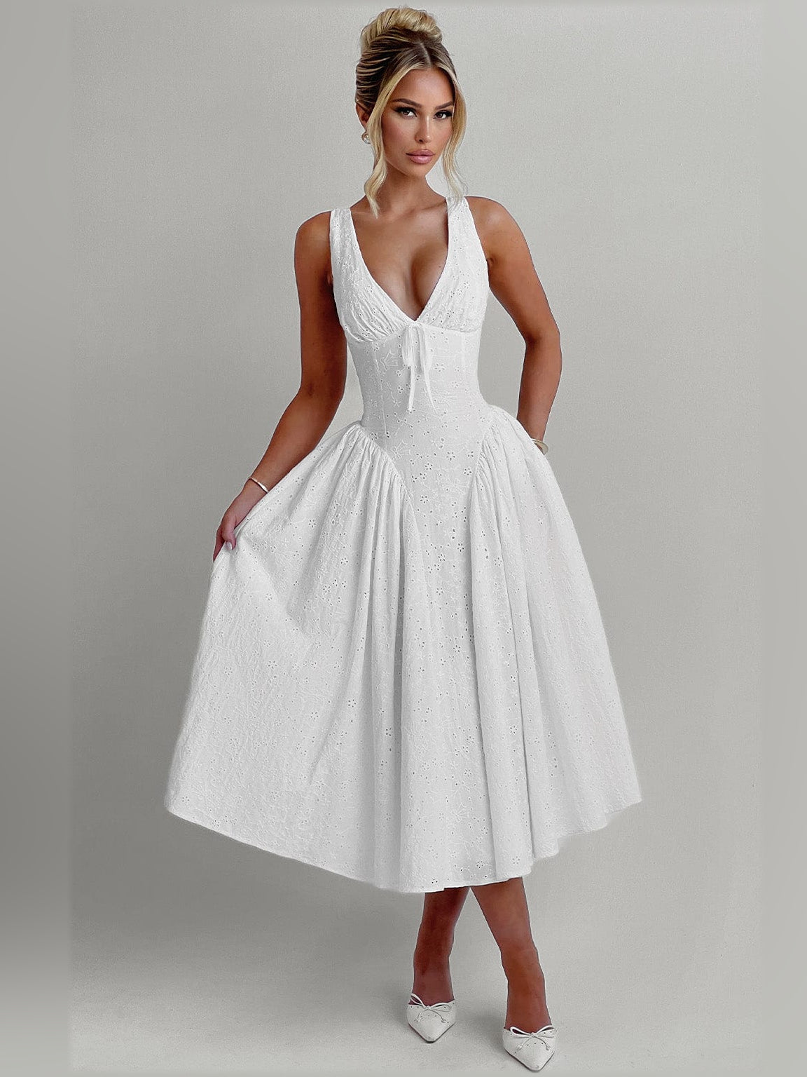 Ivory midi formal dress with deep V-neck, sleeveless design, and flared gathered hem