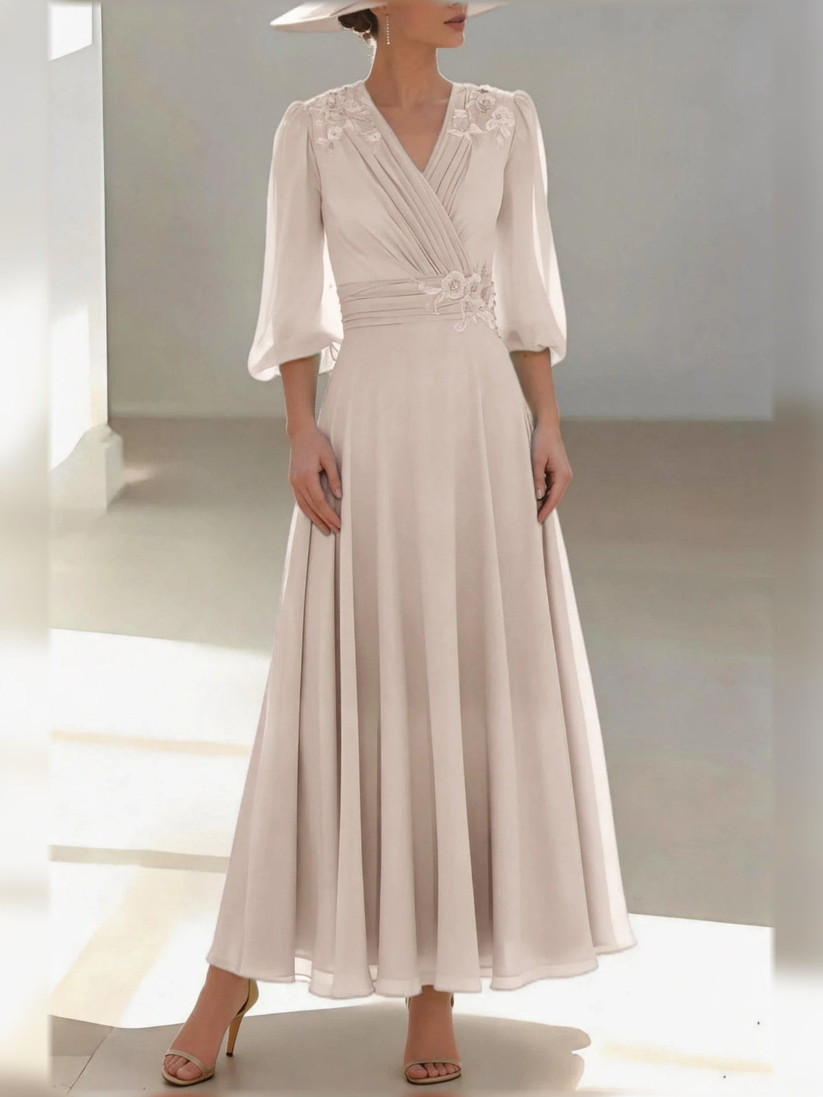 Cream chiffon V-neck A-line dress with floral applique, 3/4 sleeves, pleated floor-length skirt