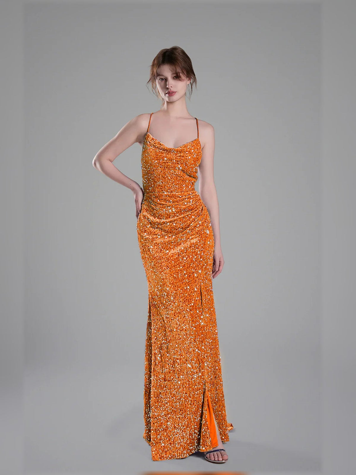 Orange sequin floor-length formal dress with spaghetti straps and side slit