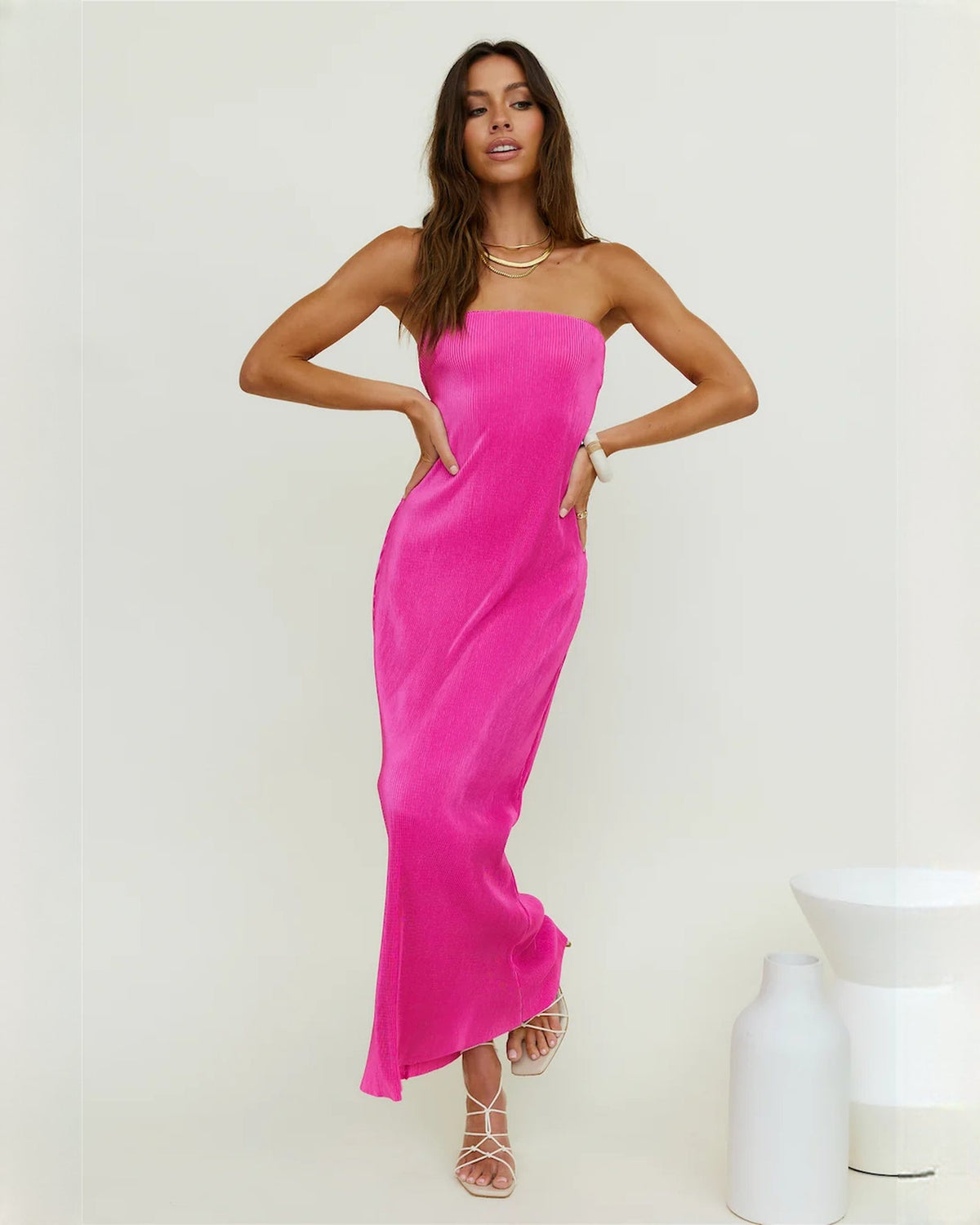 Pink strapless satin maxi dress with A-line skirt and small side slit