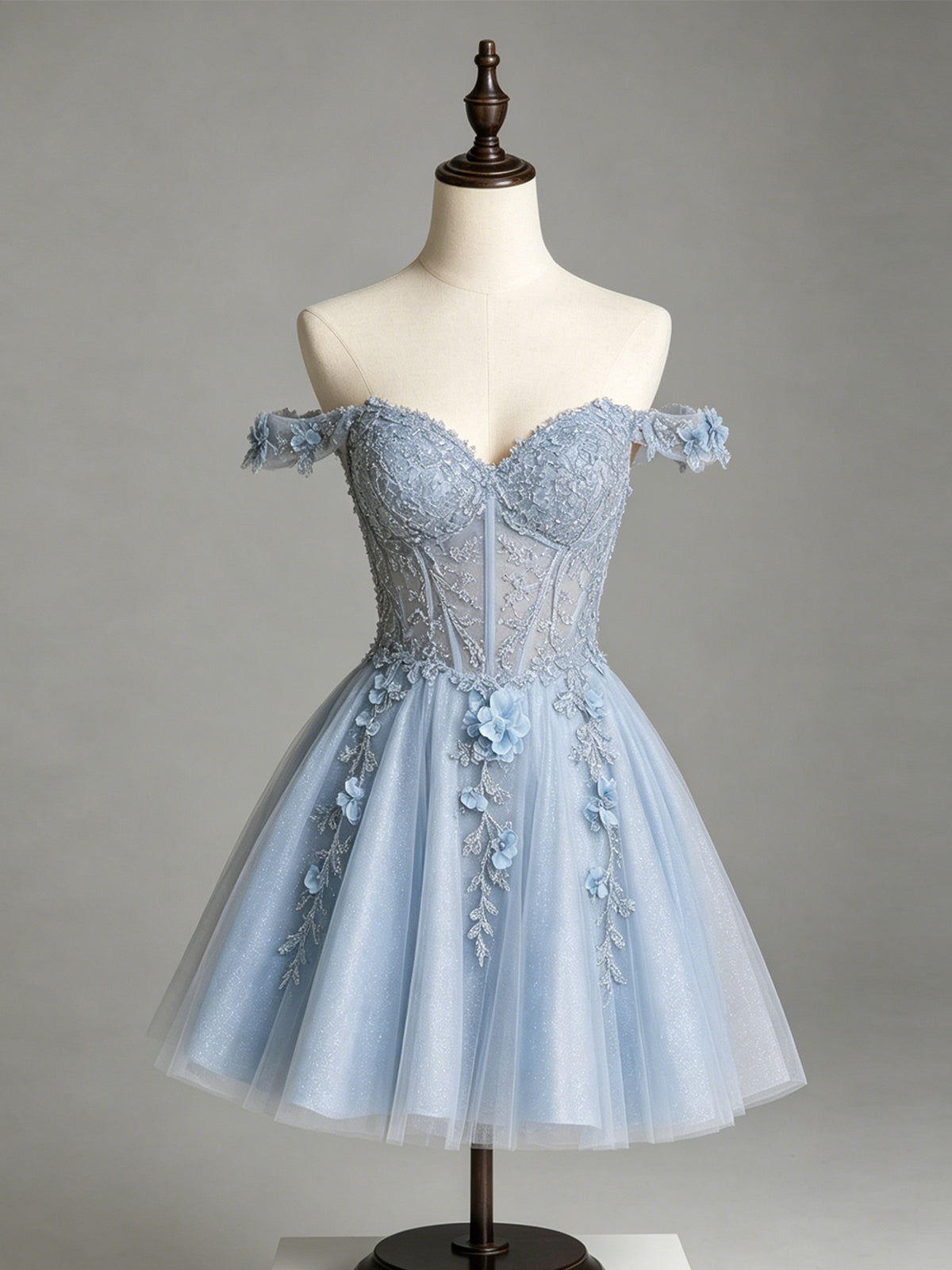 Light blue off-shoulder glitter tulle corset dress on mannequin with 3D floral embroidery