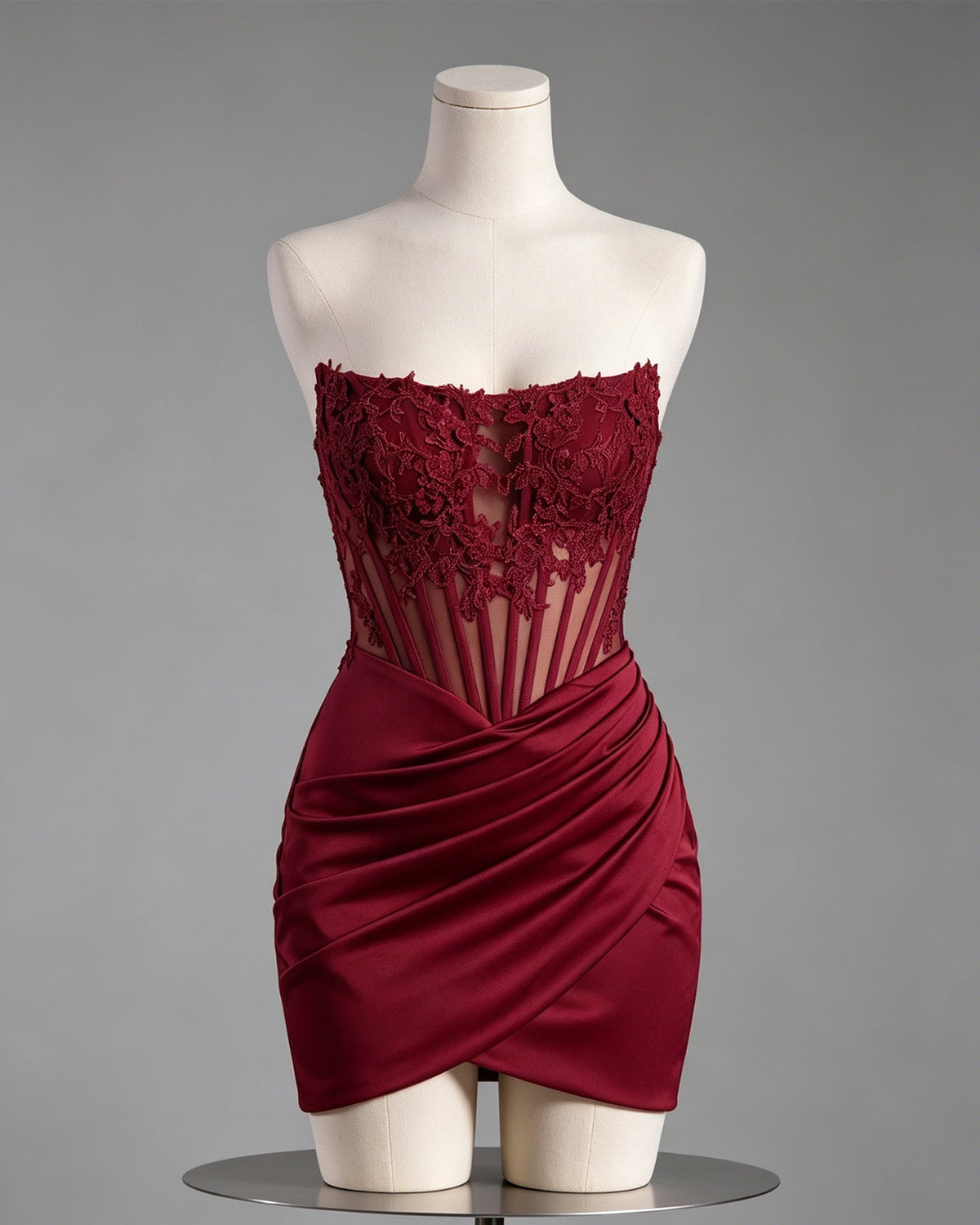 Burgundy strapless lace applique ruched satin mini dress on mannequin