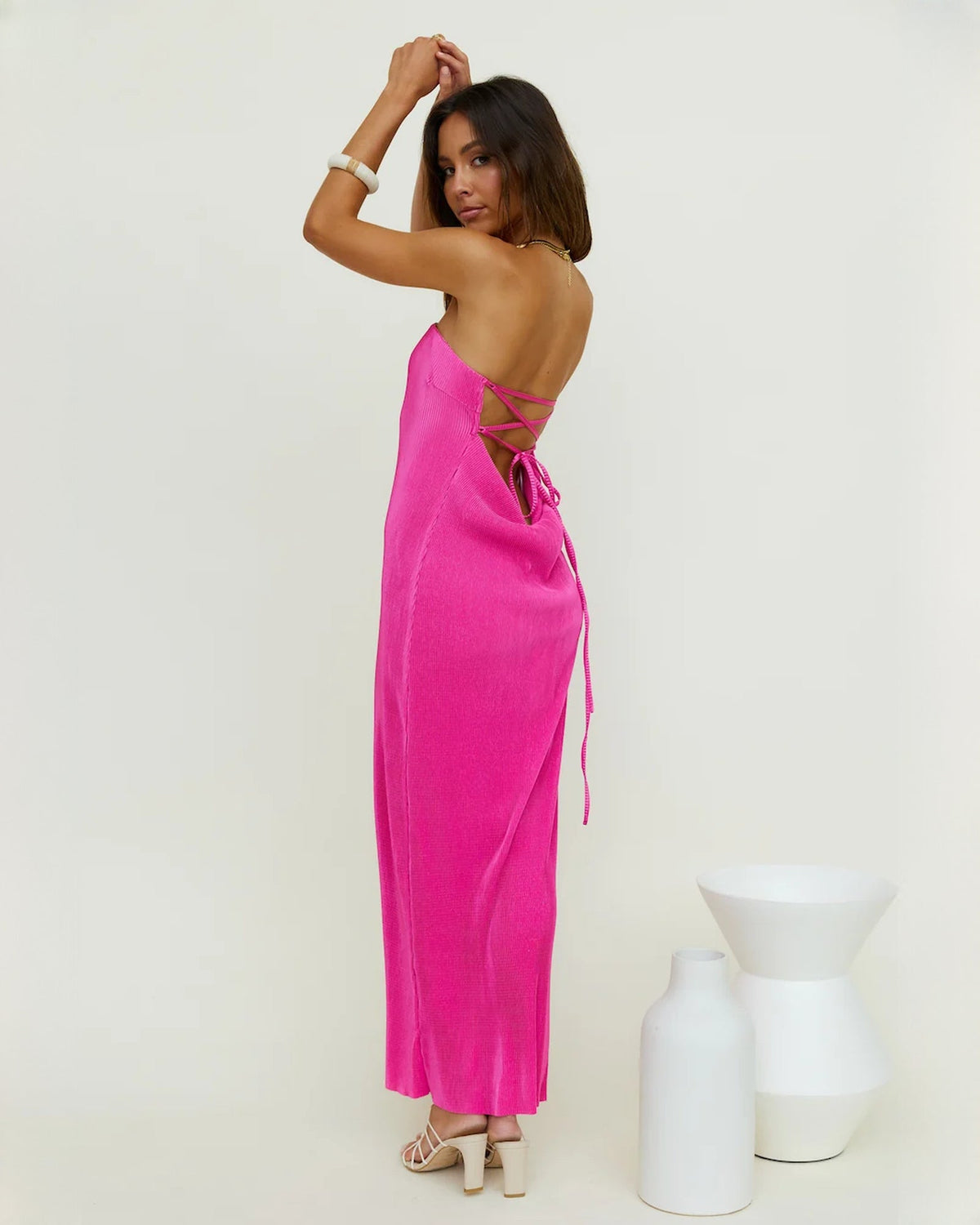 Pink satin backless maxi dress with lace-up tie detail and strapless front