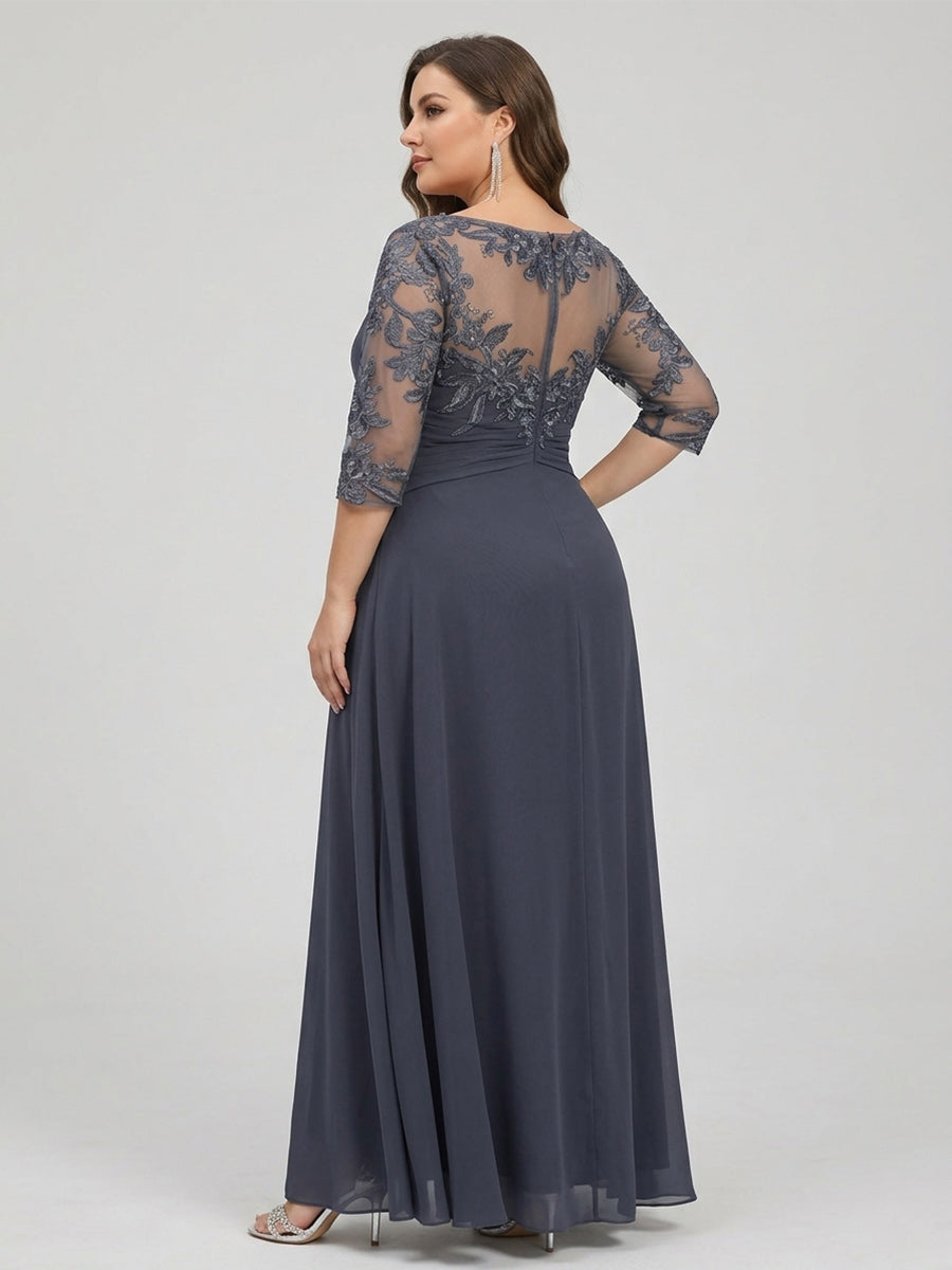 Chiffon mother-of-the-bride dress in dark navy, sheer lace sleeves, open back, flowing skirt