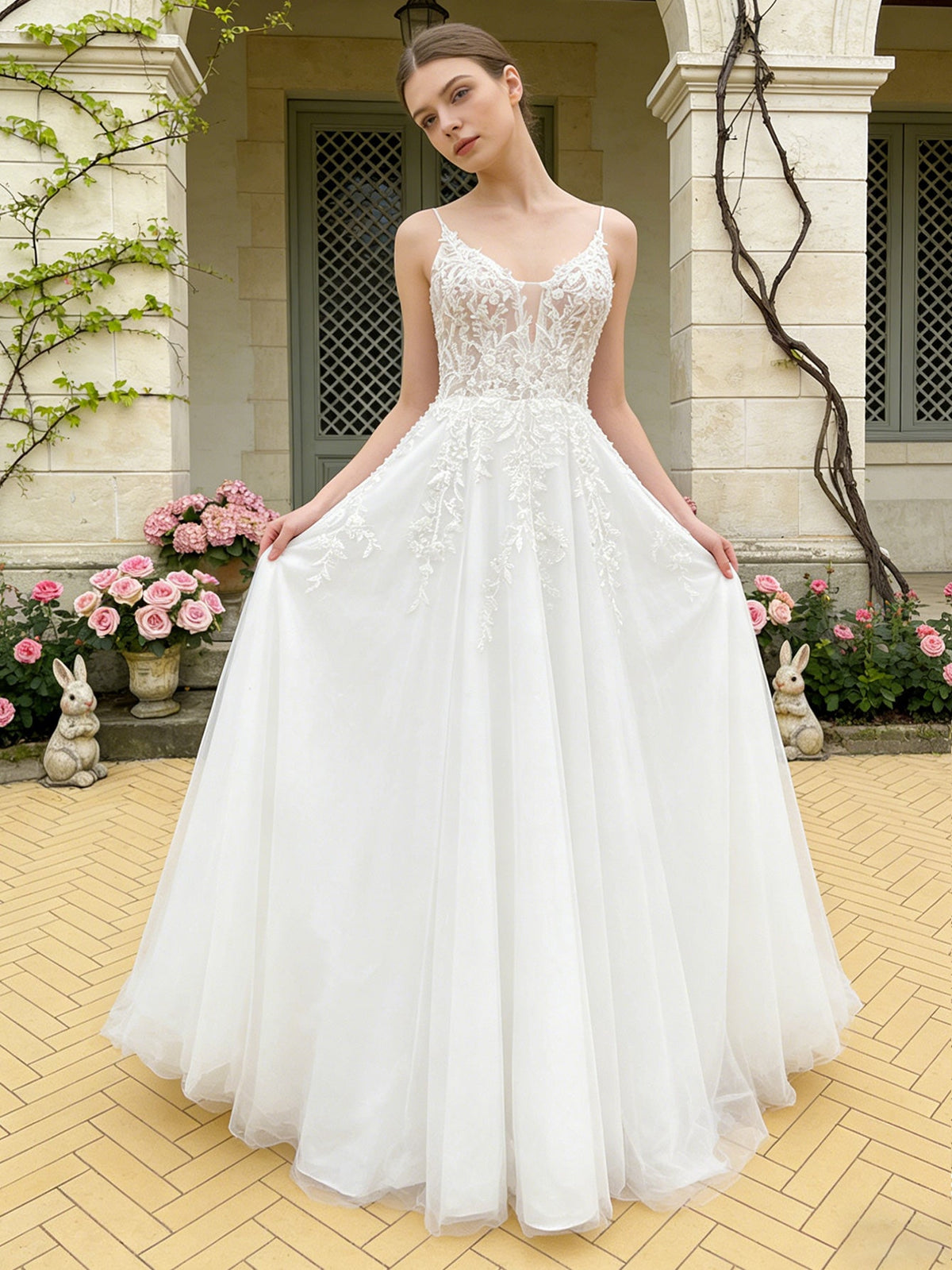 White lace ball gown wedding dress with spaghetti straps and V-neck bodice