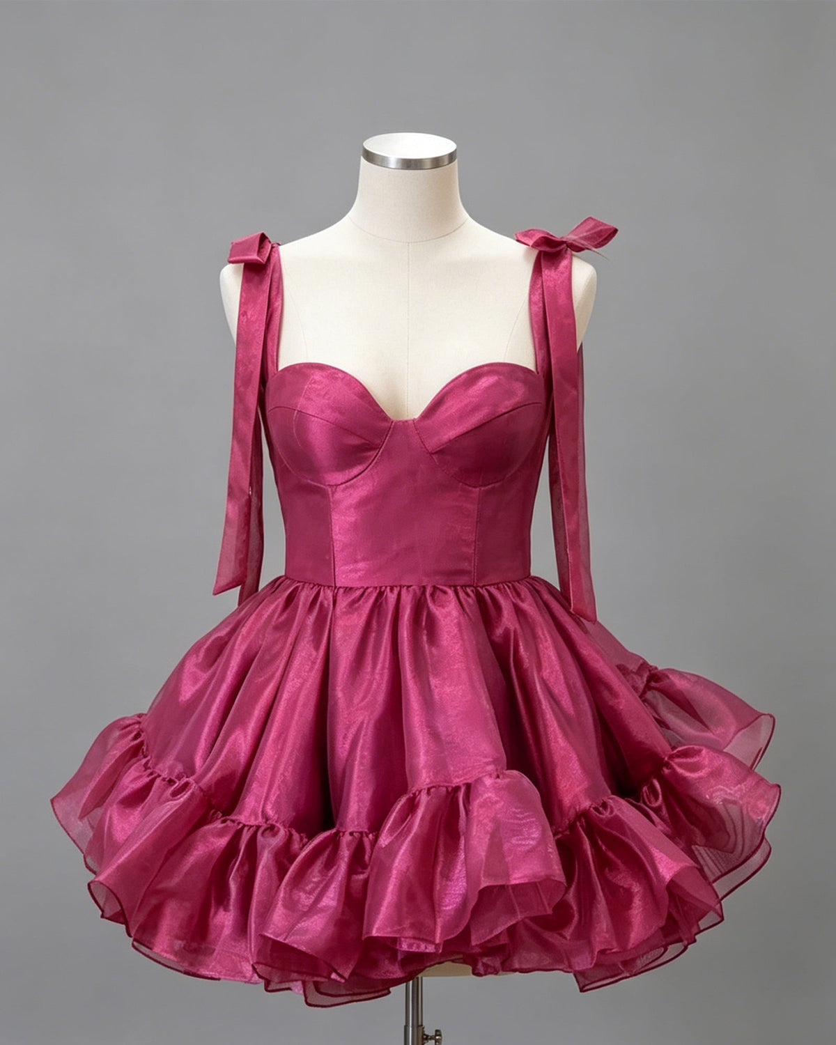 Magenta satin corset homecoming dress with sweetheart bodice and tiered ruffle skirt