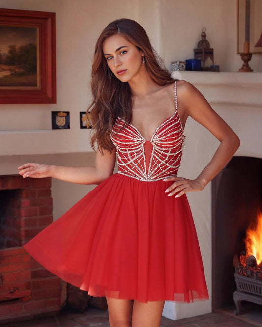 Red tulle A-line homecoming dress with rhinestone corset-style spaghetti straps