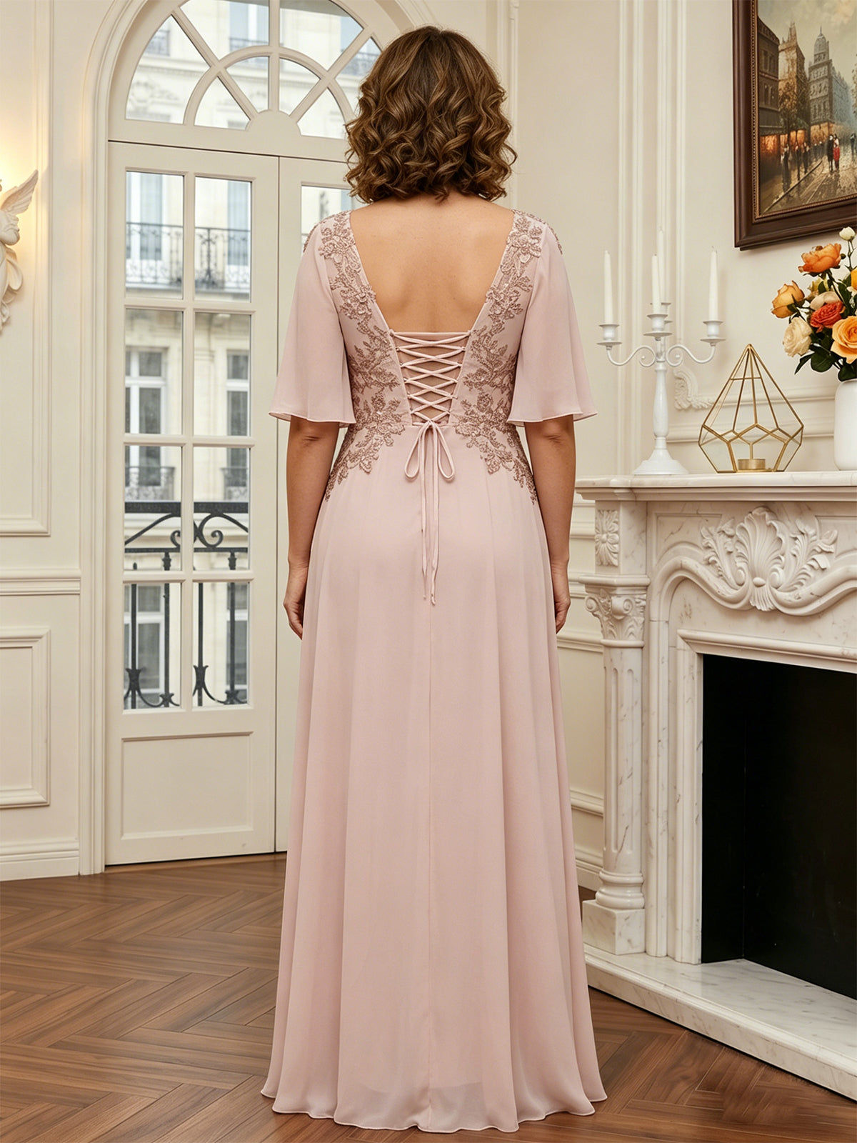 Blush pink long A-line chiffon gown, lace back detailing and flutter sleeves