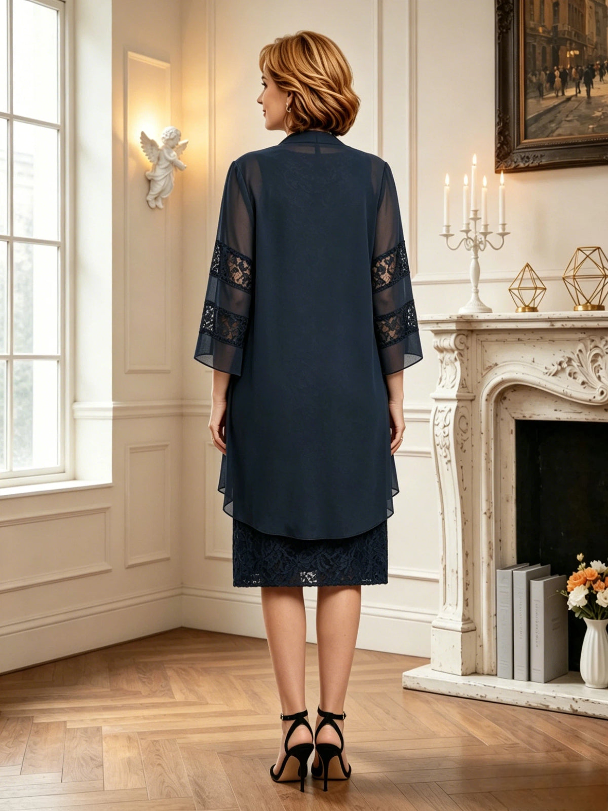 knee length lace mother of the bride dress with matching sheer chiffon jacket shown on model in a formal wedding guest styling