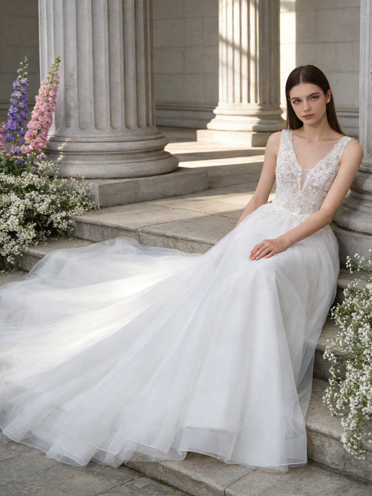 sleeveless V-neck tulle wedding dress with lace bodice and full skirt - image 1