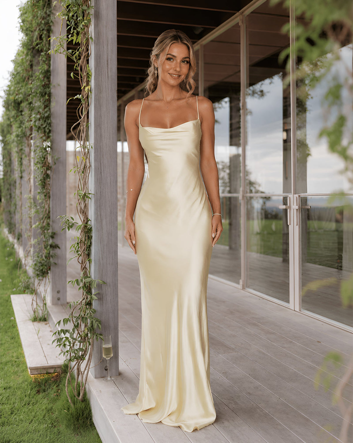 Satin slip bridesmaid dress with spaghetti straps, cowl neck, and lace-up back; cream