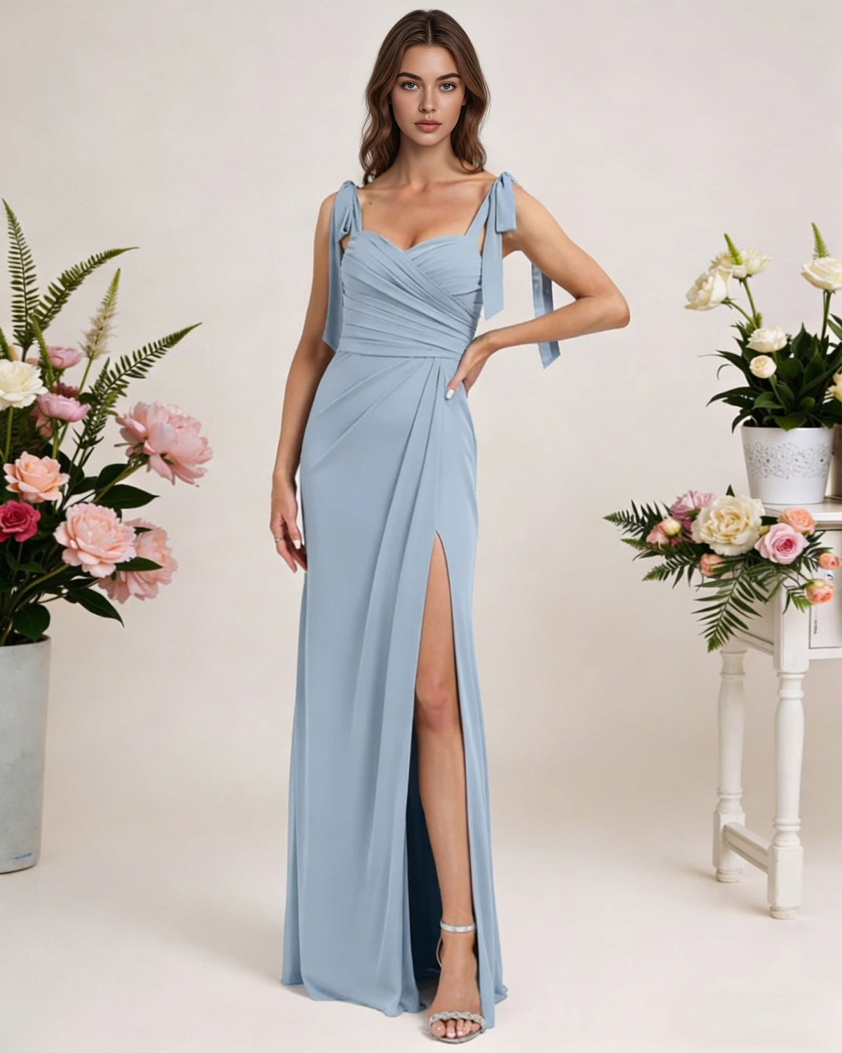 Light blue chiffon bridesmaid dress with square neck, tie straps, and high slit