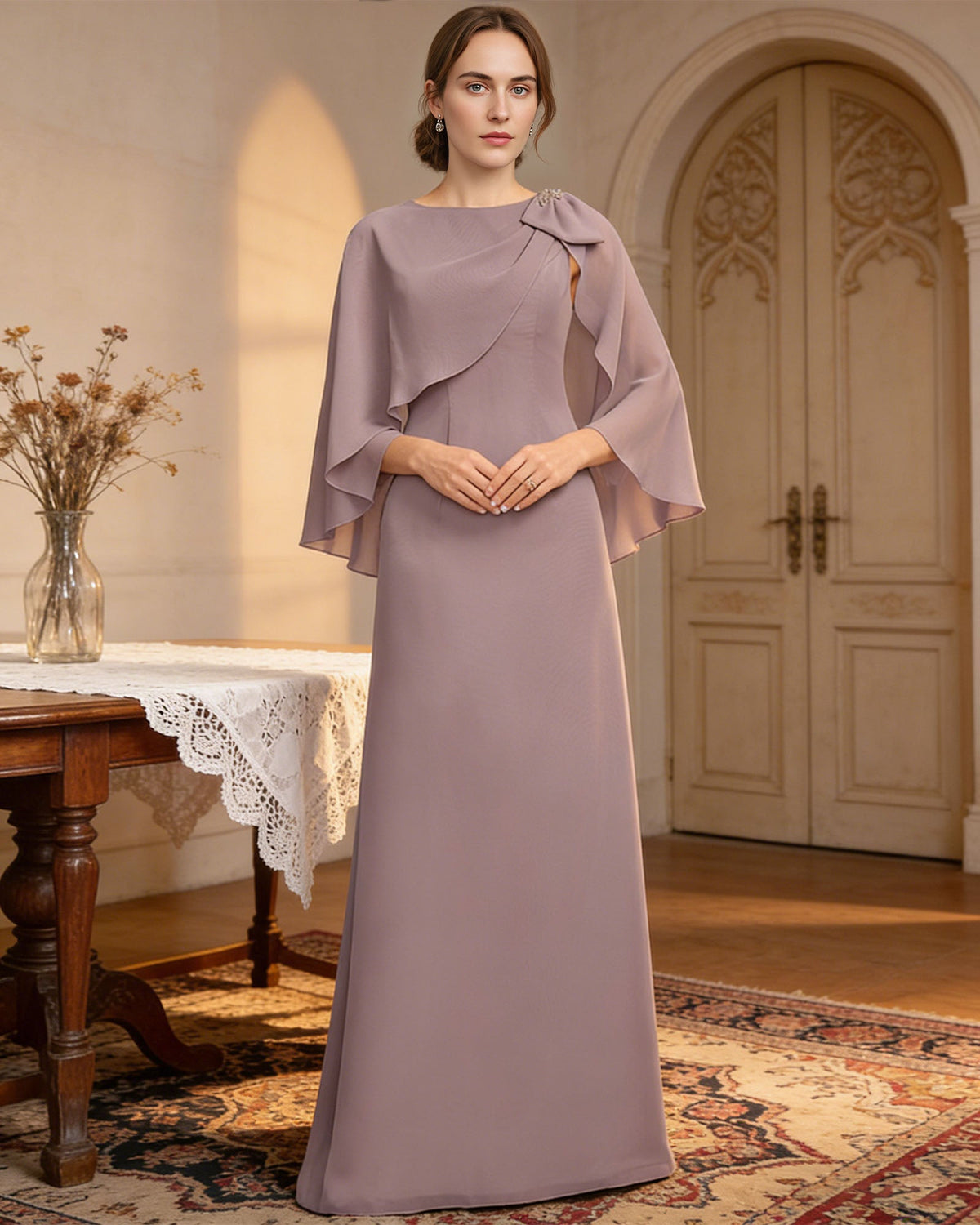 long cape sleeve mother of the bride dress with jewel neckline, bow shoulder, and chiffon column skirt