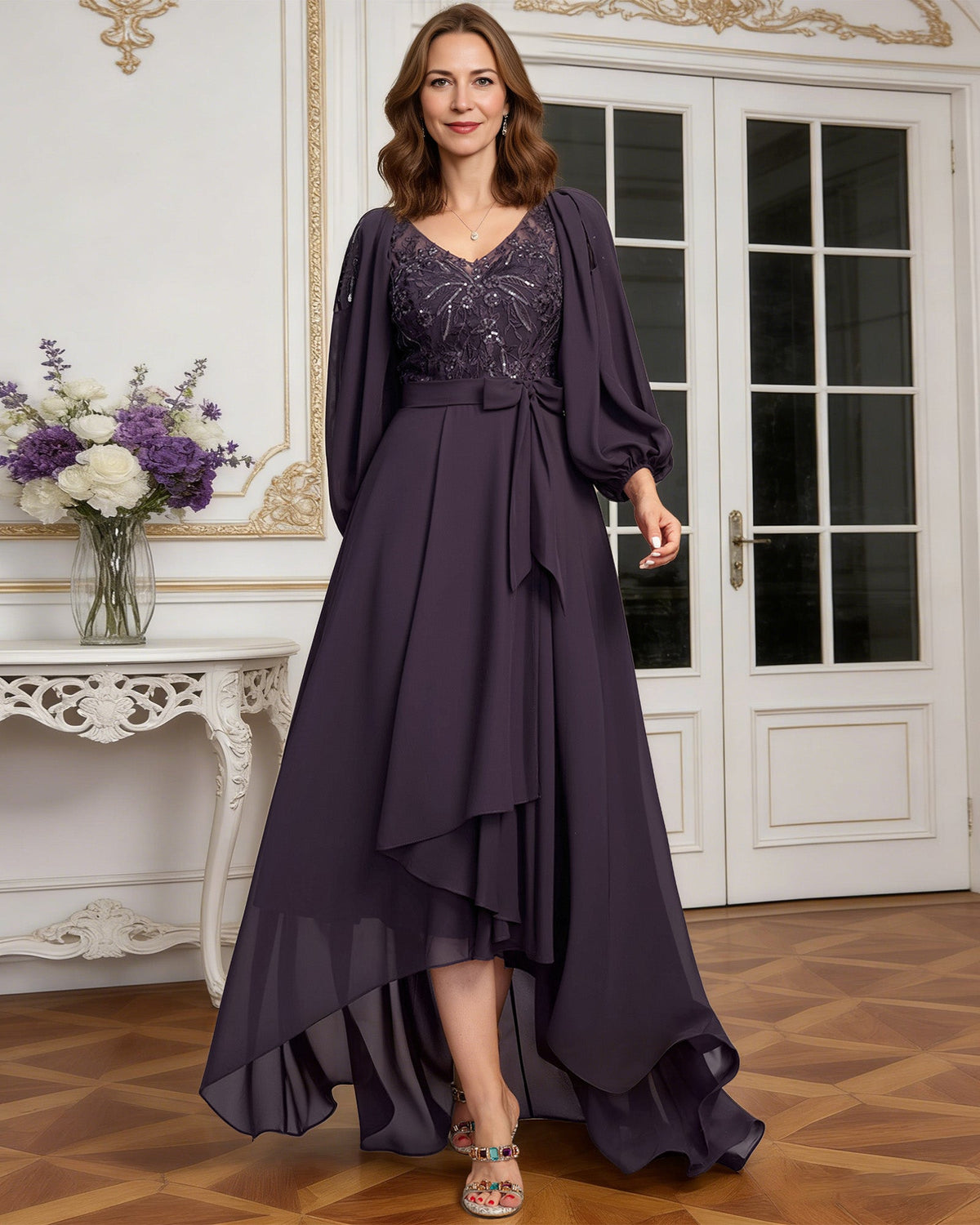 high low mother of the bride dress with lace bodice, chiffon jacket sleeves, tie waist, and layered skirt