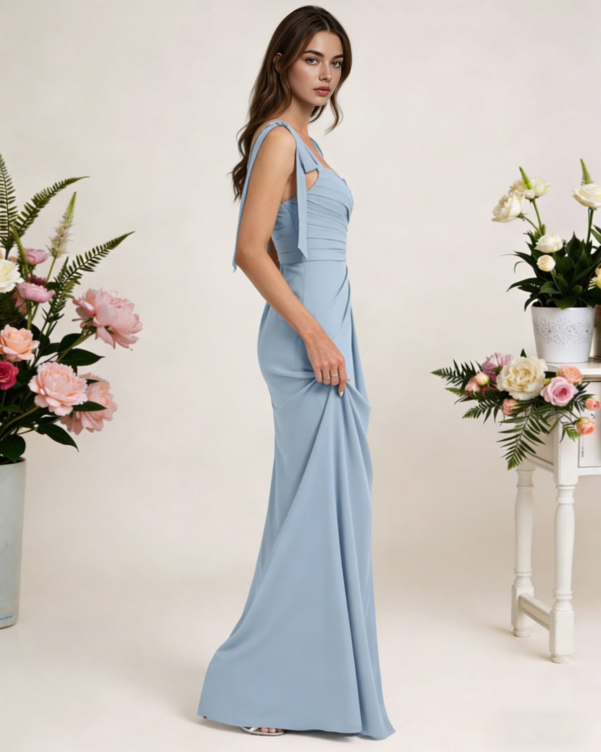 Light blue chiffon bridesmaid dress with square neck, tie straps, and side high slit