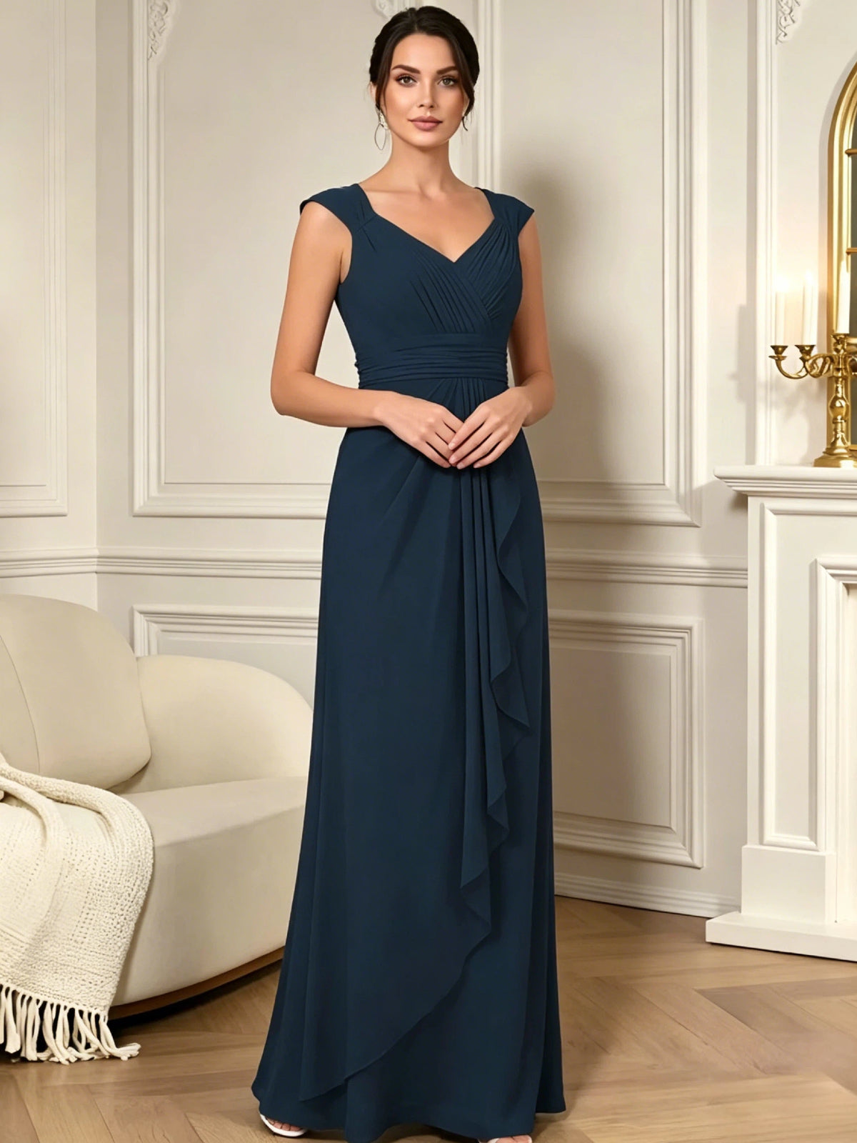 long sleeveless V-neck chiffon mother of the bride gown with pleated bodice and cascading ruffle detail front detail highlighting the bodice and flattering silhouette
