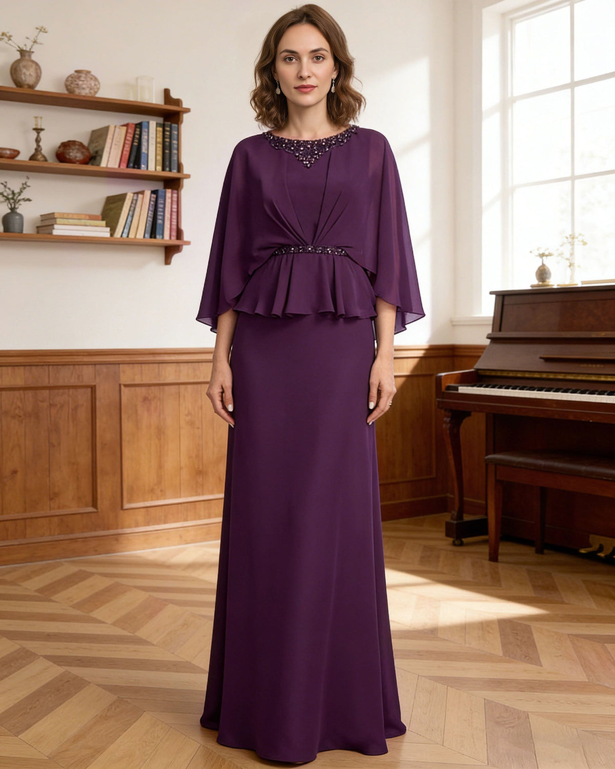 Purple mother-of-the-bride gown with beaded collar, draped capelet sleeves, and peplum detail.