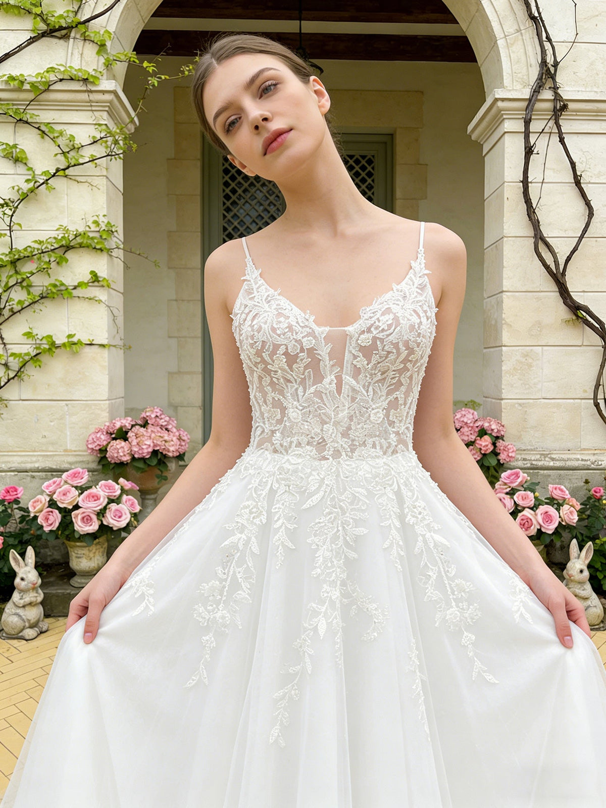 White lace wedding dress bodice with spaghetti straps and full tulle ball skirt