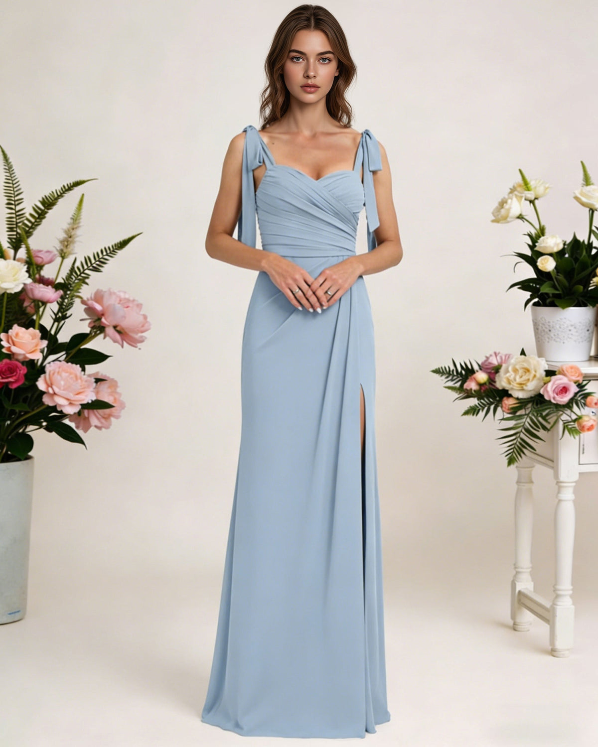 Light blue chiffon bridesmaid dress with square neck, tie straps, and long high slit