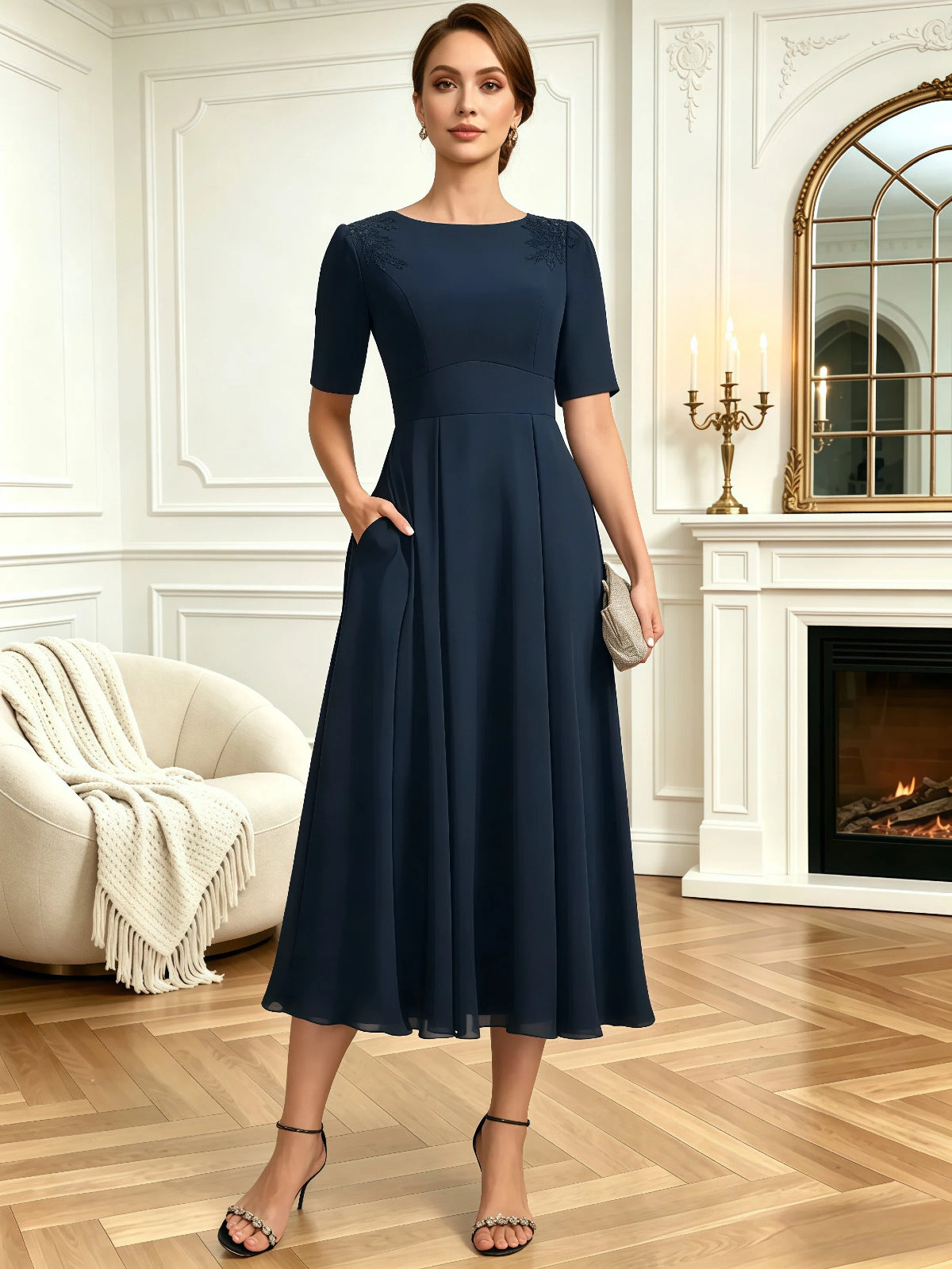 tea length mother of the bride dress with jewel neckline, short sleeves, A-line skirt, and shoulder embroidery full outfit view for ceremony and reception styling
