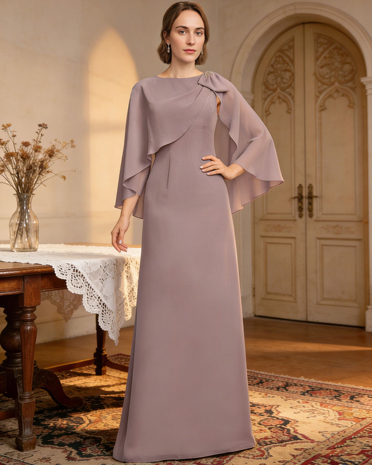 long cape sleeve mother of the bride dress with jewel neckline, bow shoulder, and chiffon column skirt full outfit view for ceremony and reception occasions