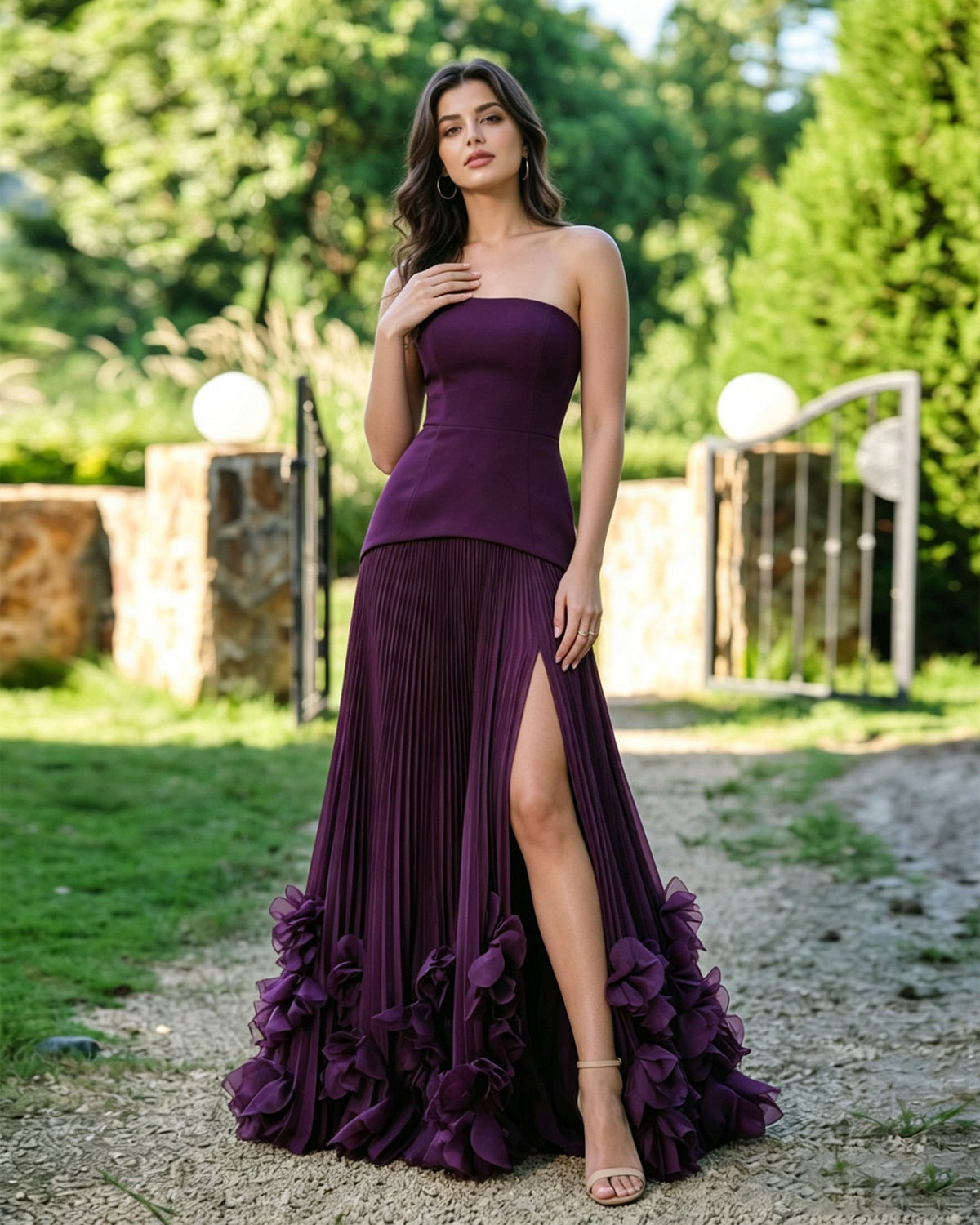 Purple strapless formal dress with pleated skirt and floral ruffle hem
