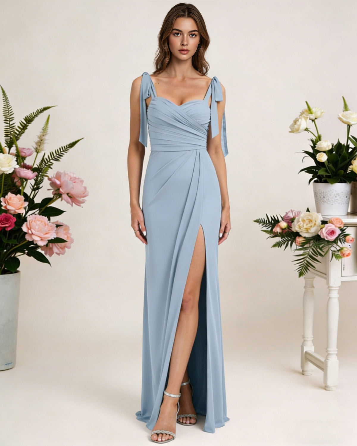 Light blue chiffon bridesmaid dress with square neck, tie straps, and front high slit
