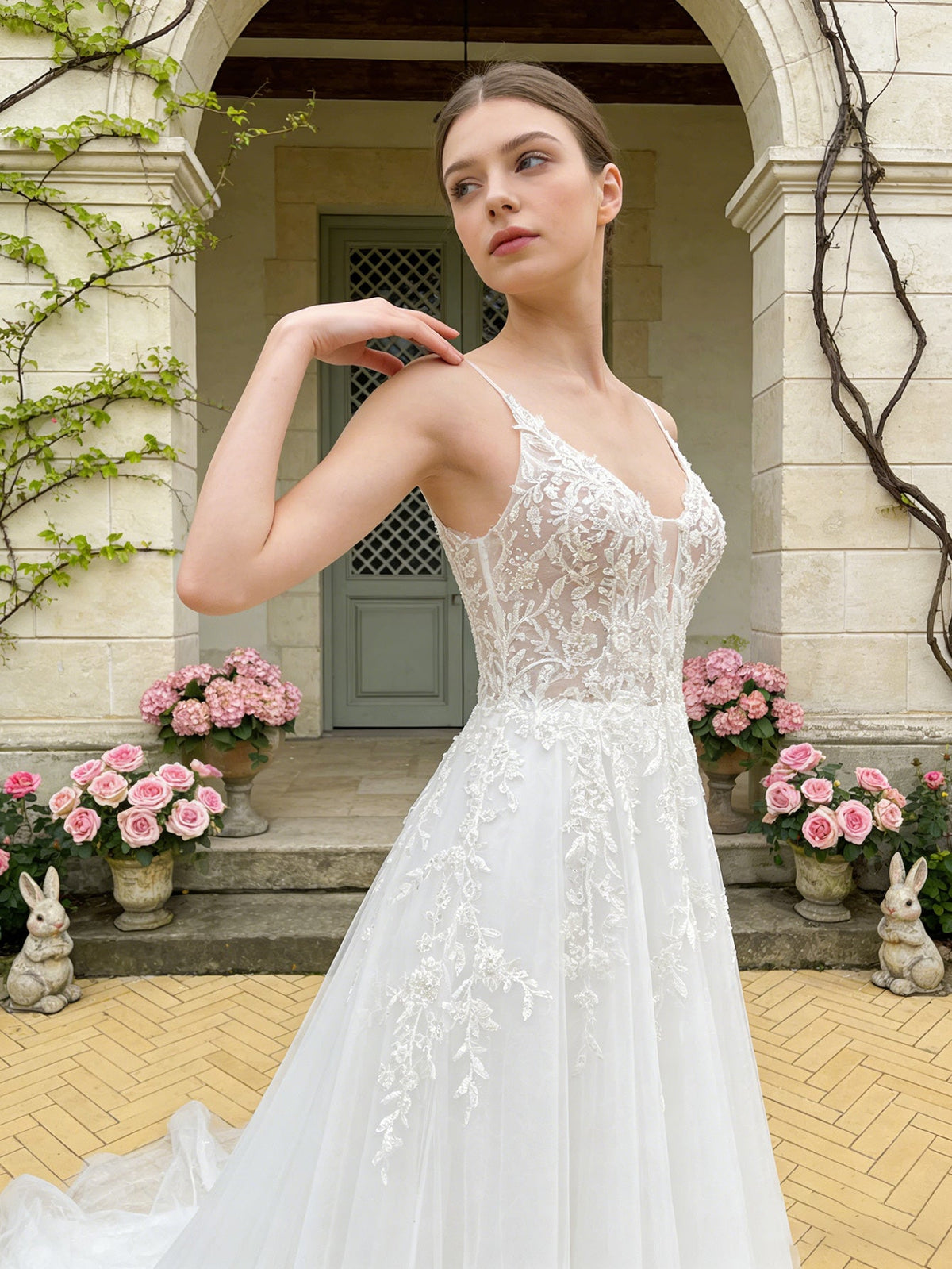 White lace ball gown wedding dress with spaghetti straps and V-neck bodice