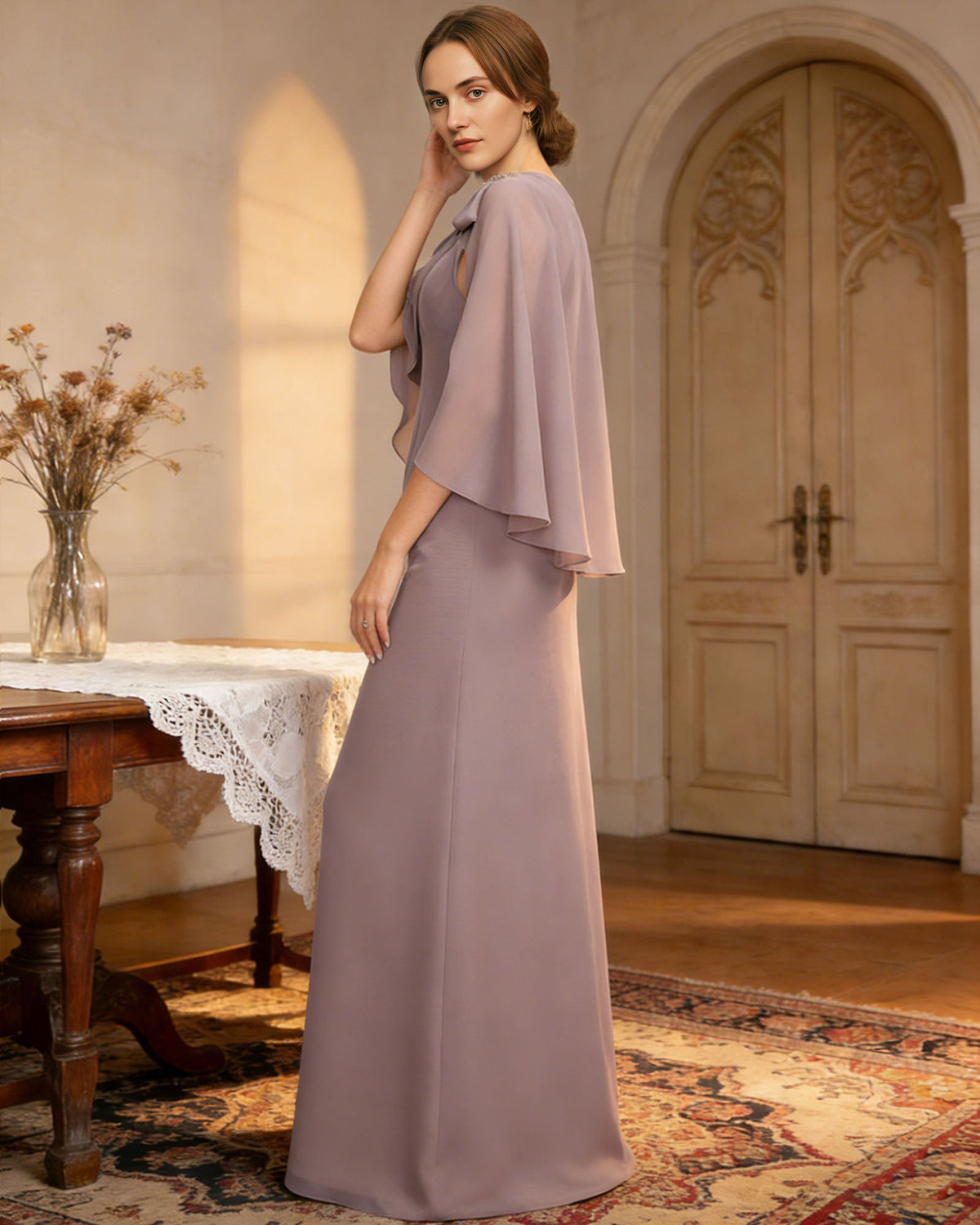long cape sleeve mother of the bride dress with jewel neckline, bow shoulder, and chiffon column skirt front detail highlighting neckline, sleeves, waist, and fabric