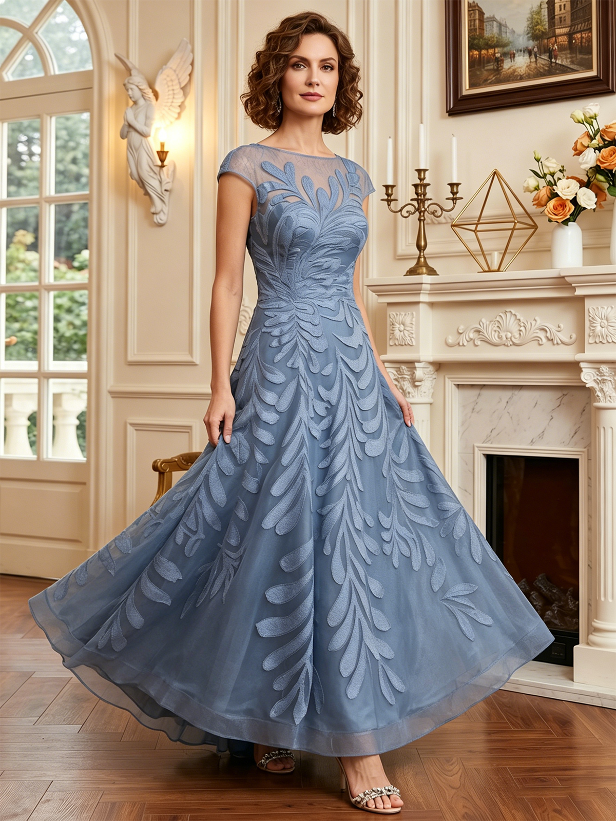 long embroidered tulle mother of the bride A-line dress with illusion neckline and cap sleeves front detail highlighting the neckline, waist, and sleeves