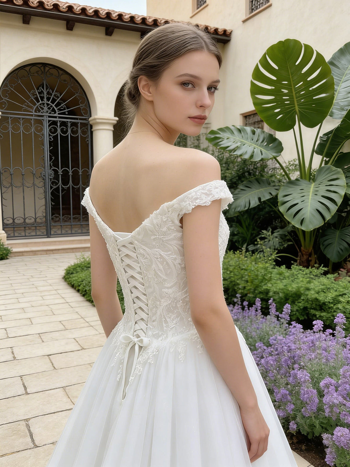 White lace tulle A-line wedding dress with off-shoulder front and crisscross back