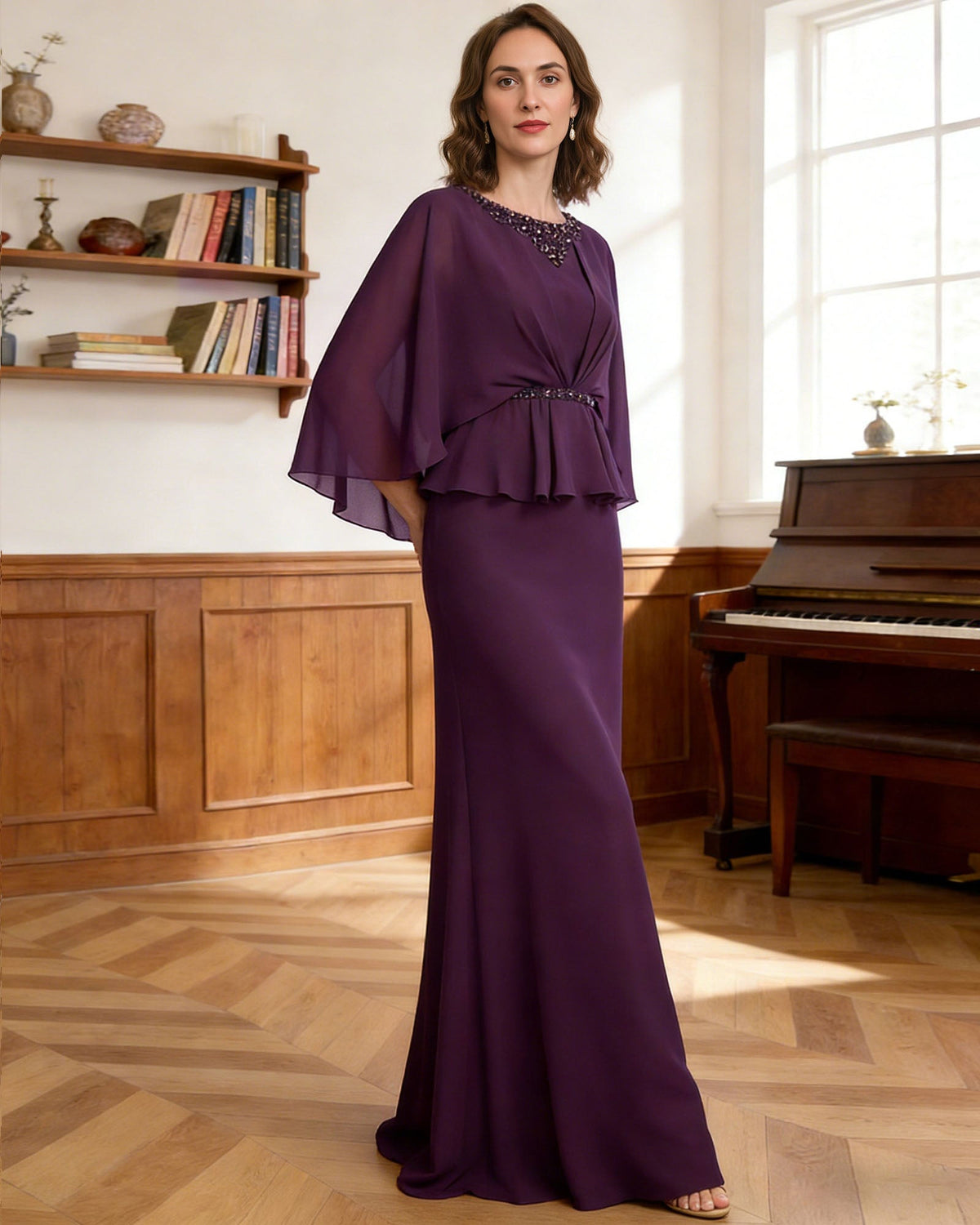 Purple long beaded dress with flutter capelet sleeves and layered peplum around the waist.