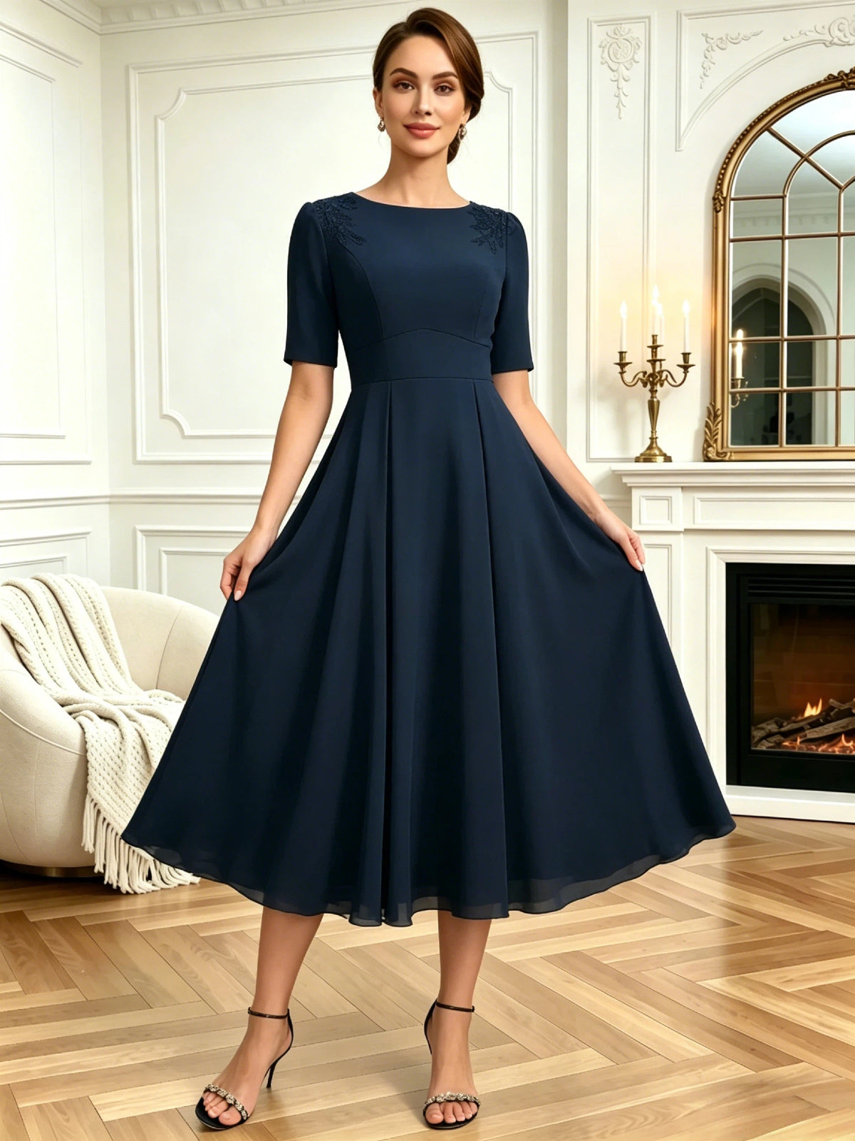 tea length mother of the bride dress with jewel neckline, short sleeves, A-line skirt, and shoulder embroidery alternate angle showing fabric drape and occasion-ready fit