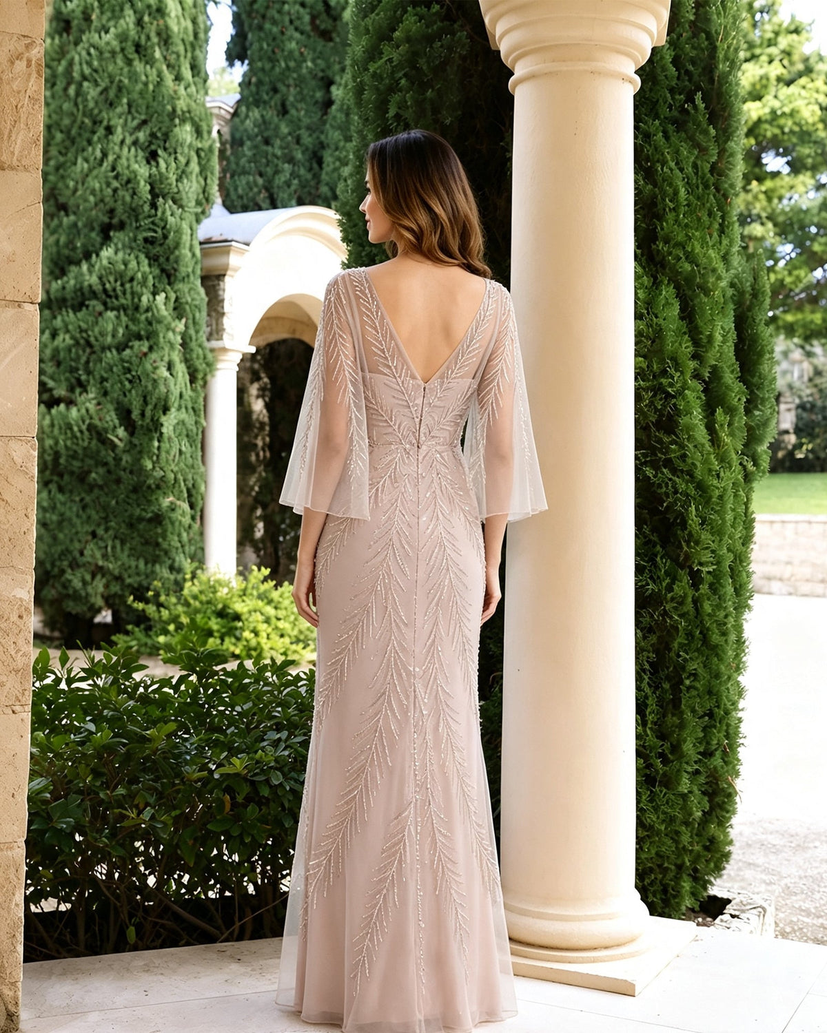 Beaded illusion mother-of-the-bride dress with bell sleeves, blush pink back view