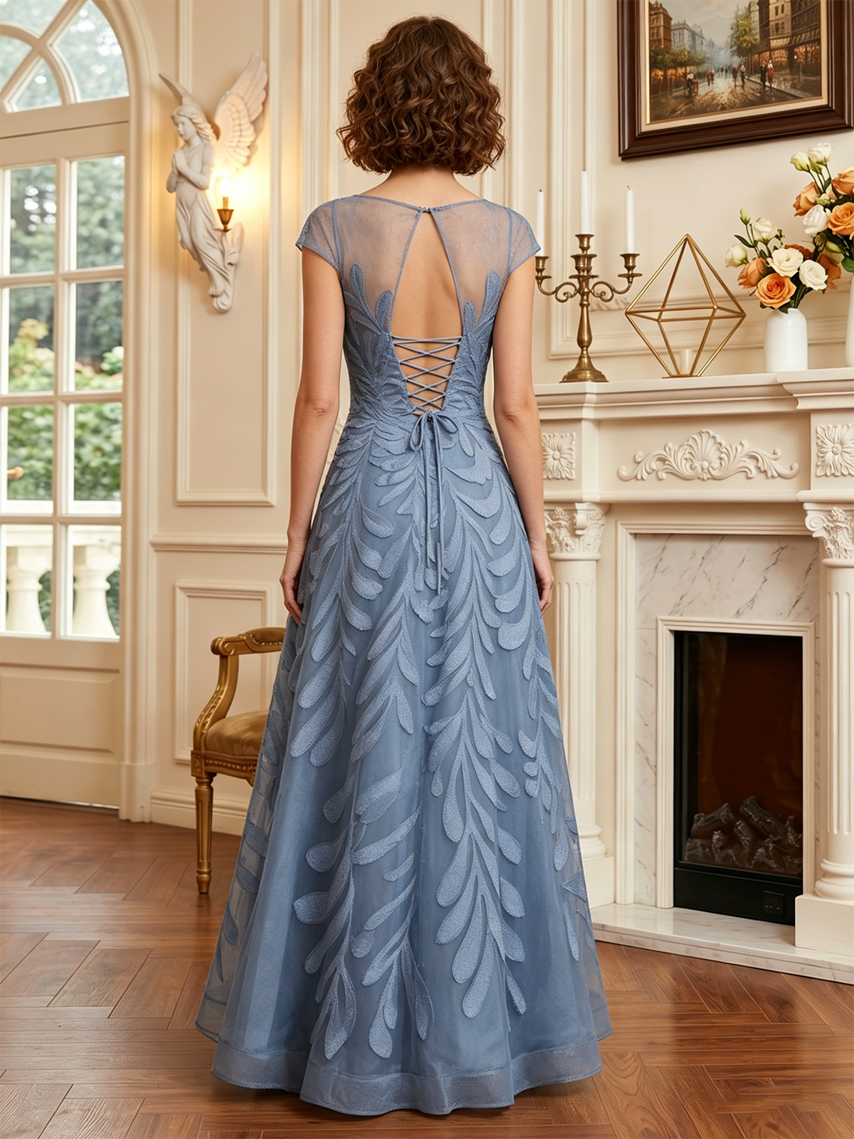 long embroidered tulle mother of the bride A-line dress with illusion neckline and cap sleeves back or side view of the bridal party dress silhouette