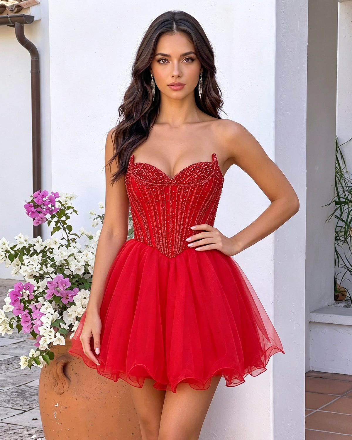 Red strapless sweetheart beaded corset mini tulle A-line dress, hand on hip