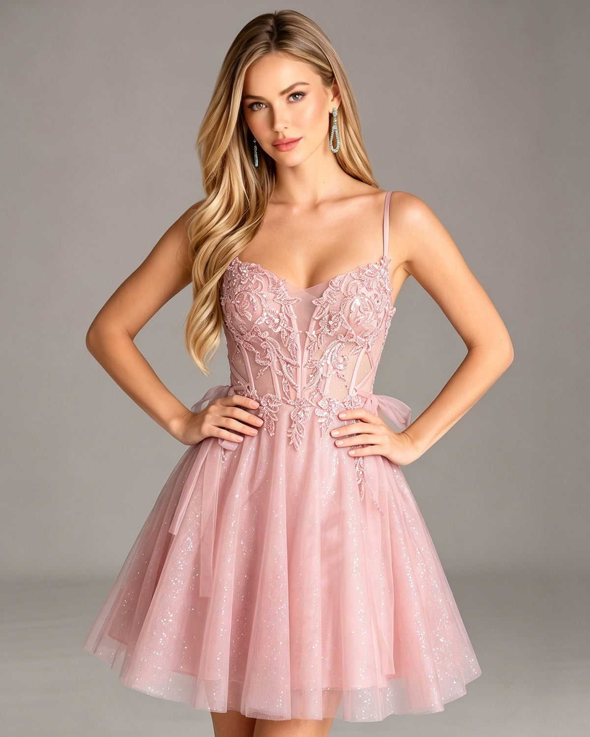 Blush pink glitter tulle homecoming dress with lace corset bodice and spaghetti straps