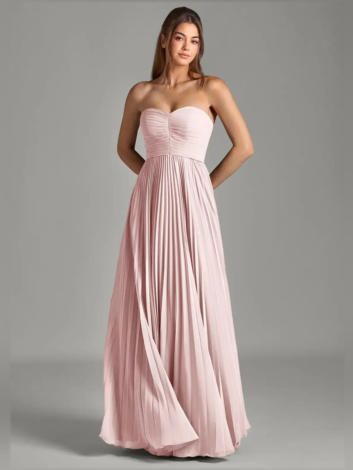 Blush pink strapless chiffon A-line formal dress with ruched bodice and pleats