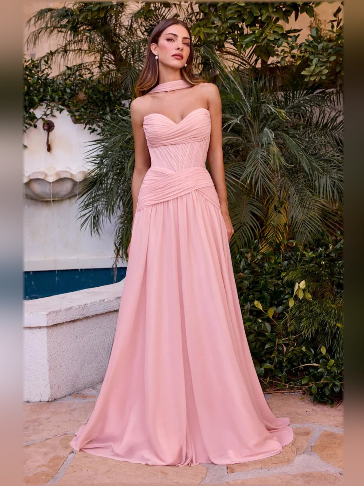 Blush pink halter-neck chiffon formal dress with sweetheart neckline, ruched bodice, and draped sash