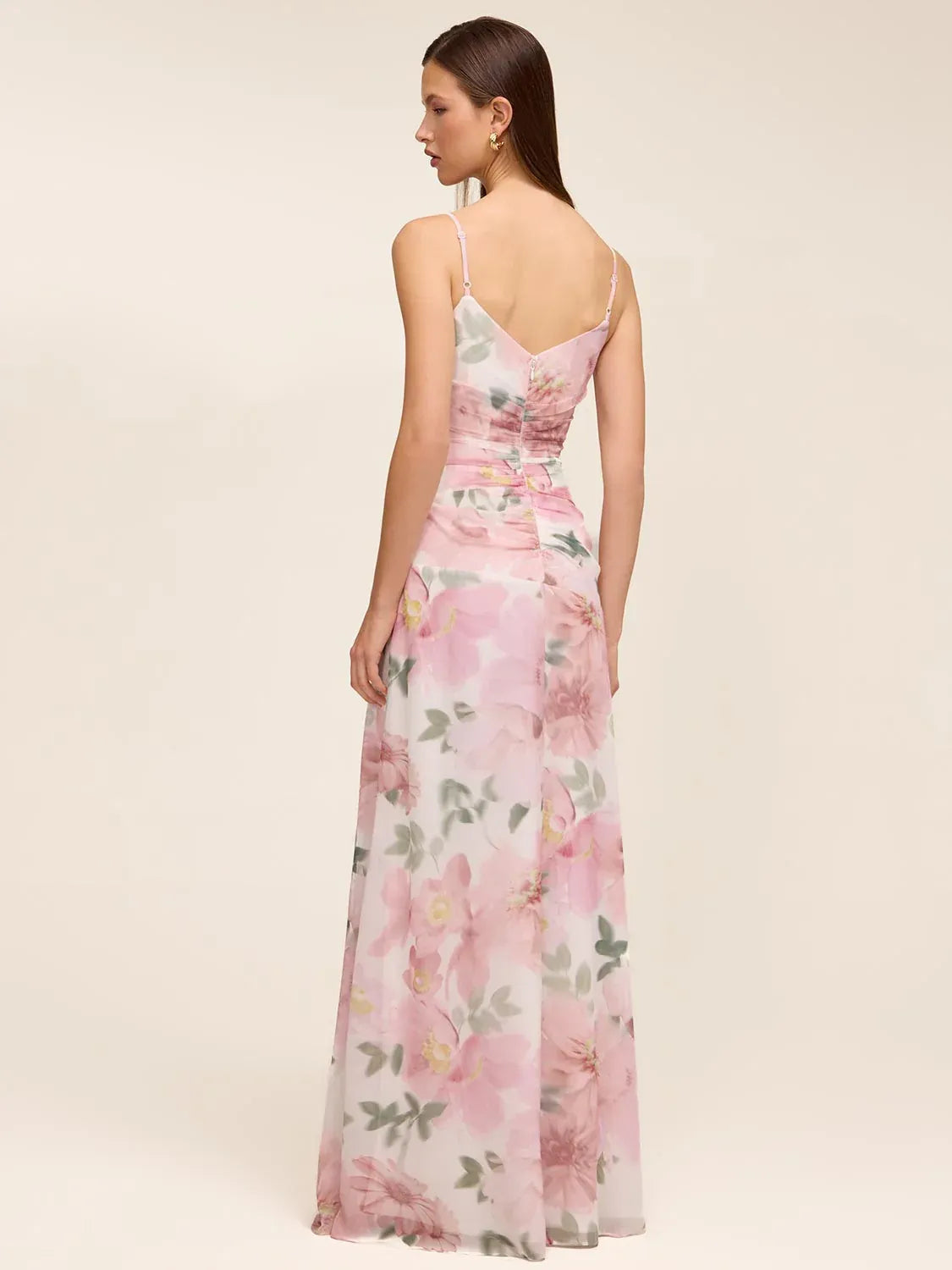 Floral spaghetti-strap gown with V-back and flowing floor-length ruffle skirt