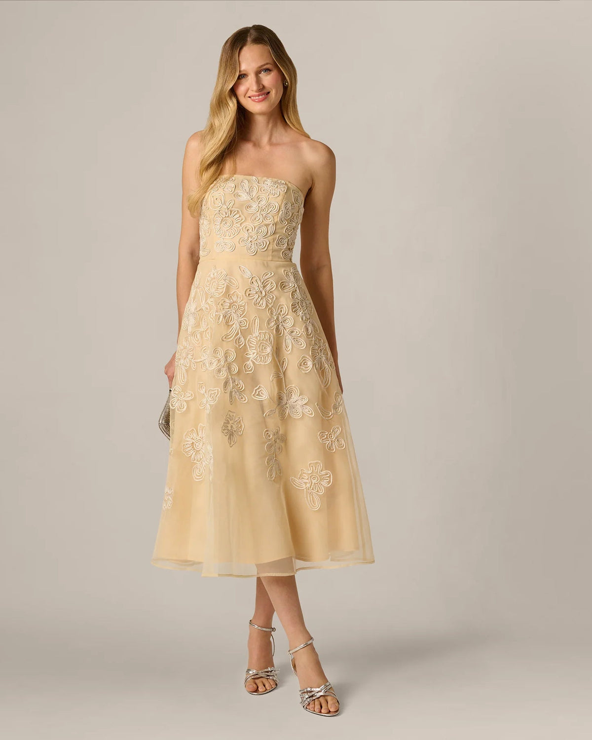 Pale yellow strapless A-line midi dress with floral embroidery and defined waist