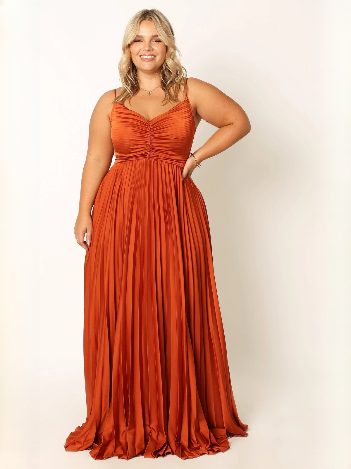 Orange V-neck spaghetti strap pleated maxi dress with flowing pleats