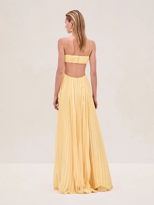 Yellow strapless pleated maxi dress with open back and flared hem