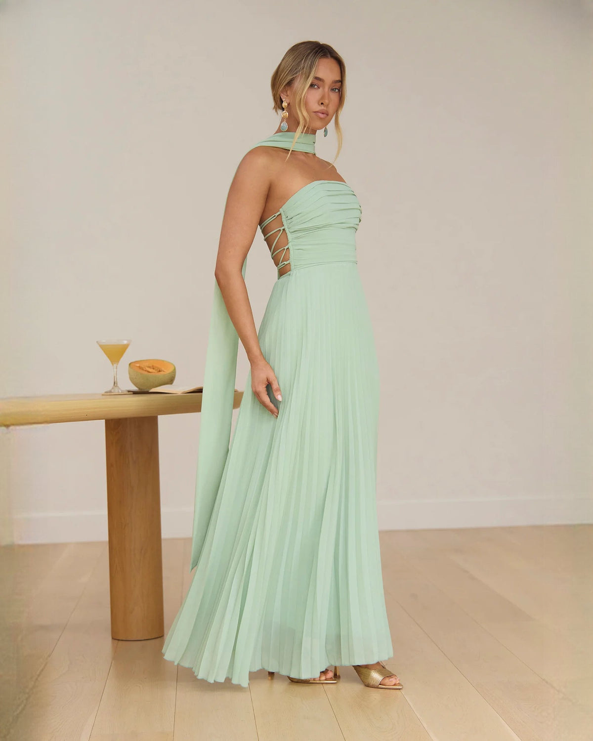 Sage green strapless chiffon maxi A-line dress with ruched top and open back