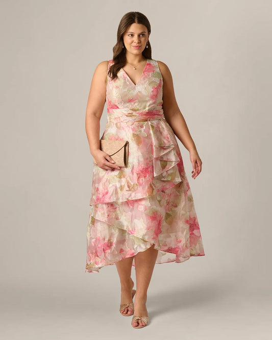 Full-length front view of floral A-line midi dress in sage multi with ruffle skirt