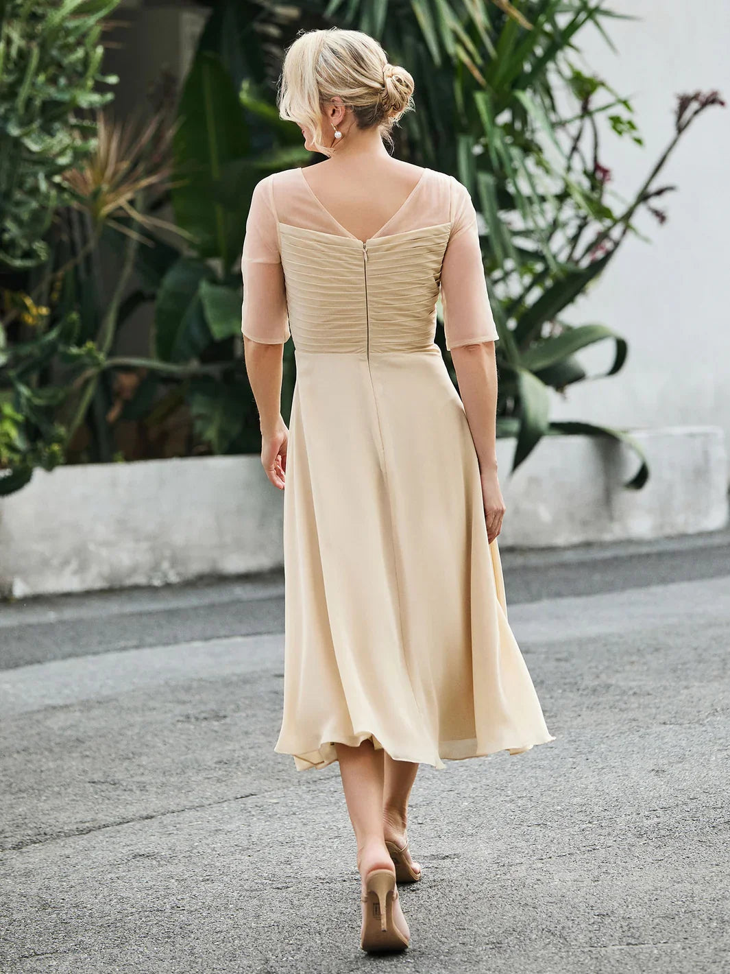Champagne chiffon A-line dress with V-back illusion neckline and three-quarter sleeves
