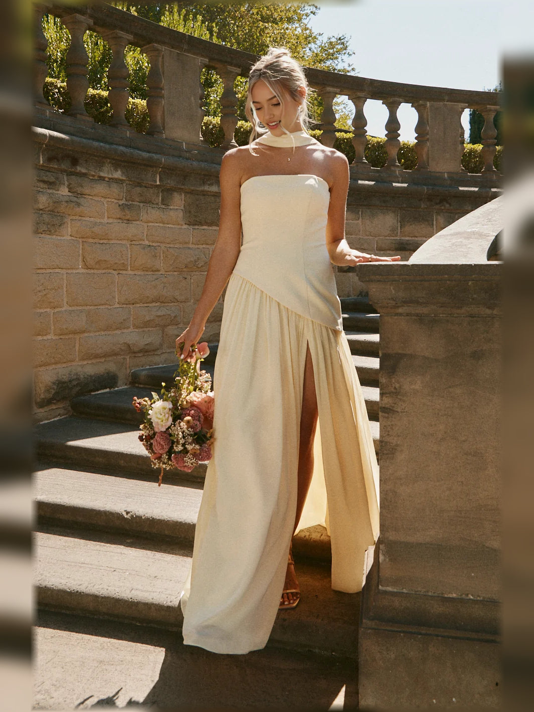 Cream strapless A-line maxi chiffon dress with pleated skirt and front slit