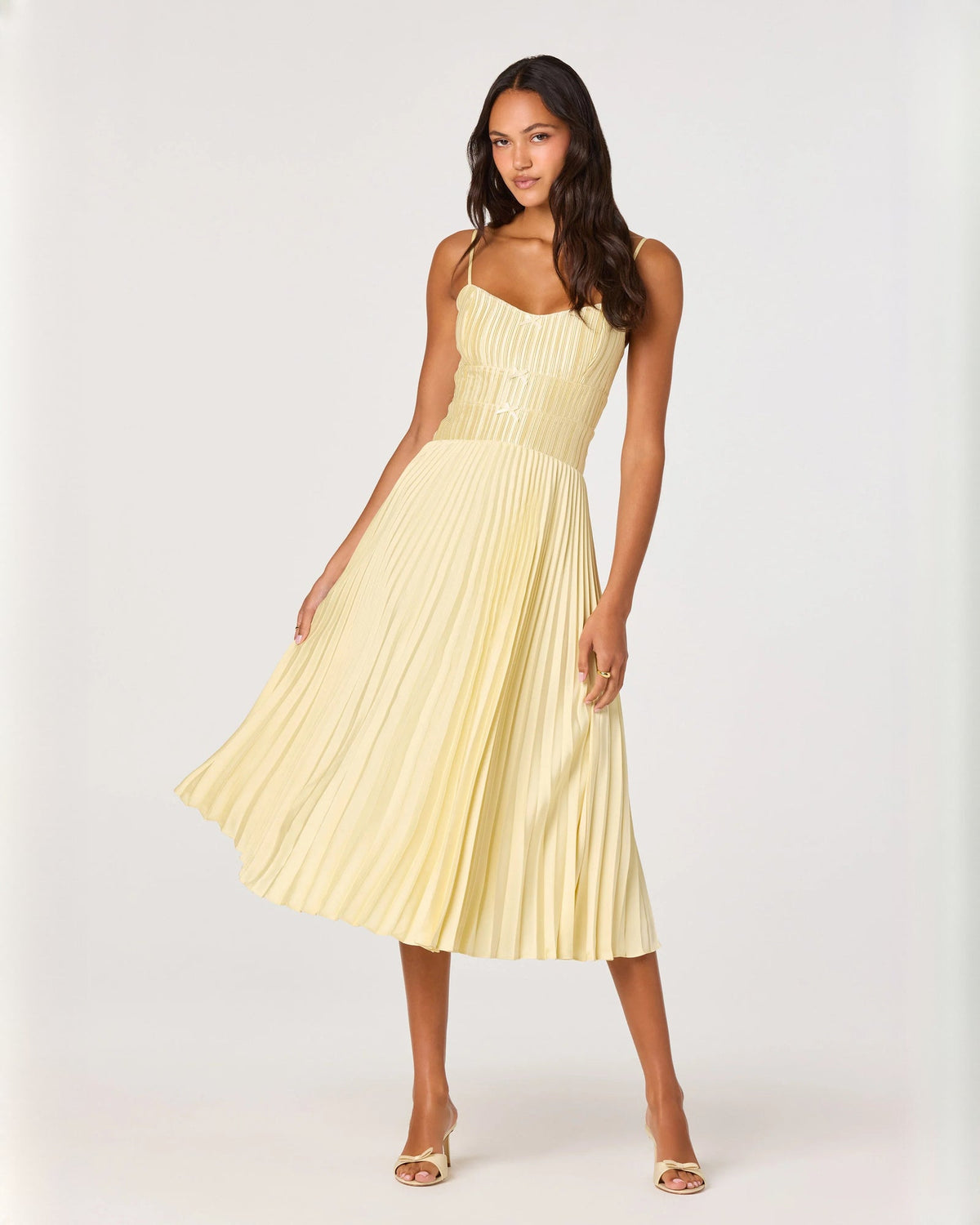 Yellow sleeveless chiffon midi dress with spaghetti straps and pleated A-line skirt