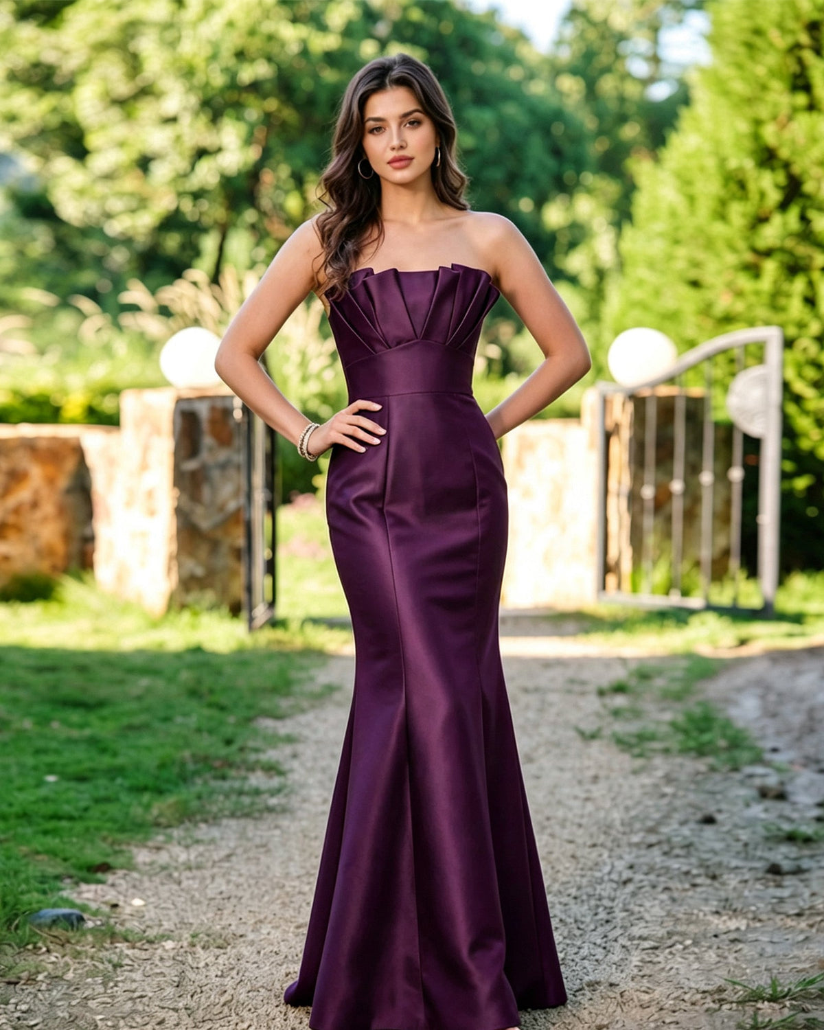 Plum strapless mermaid formal dress with pleated bodice and fitted flared skirt